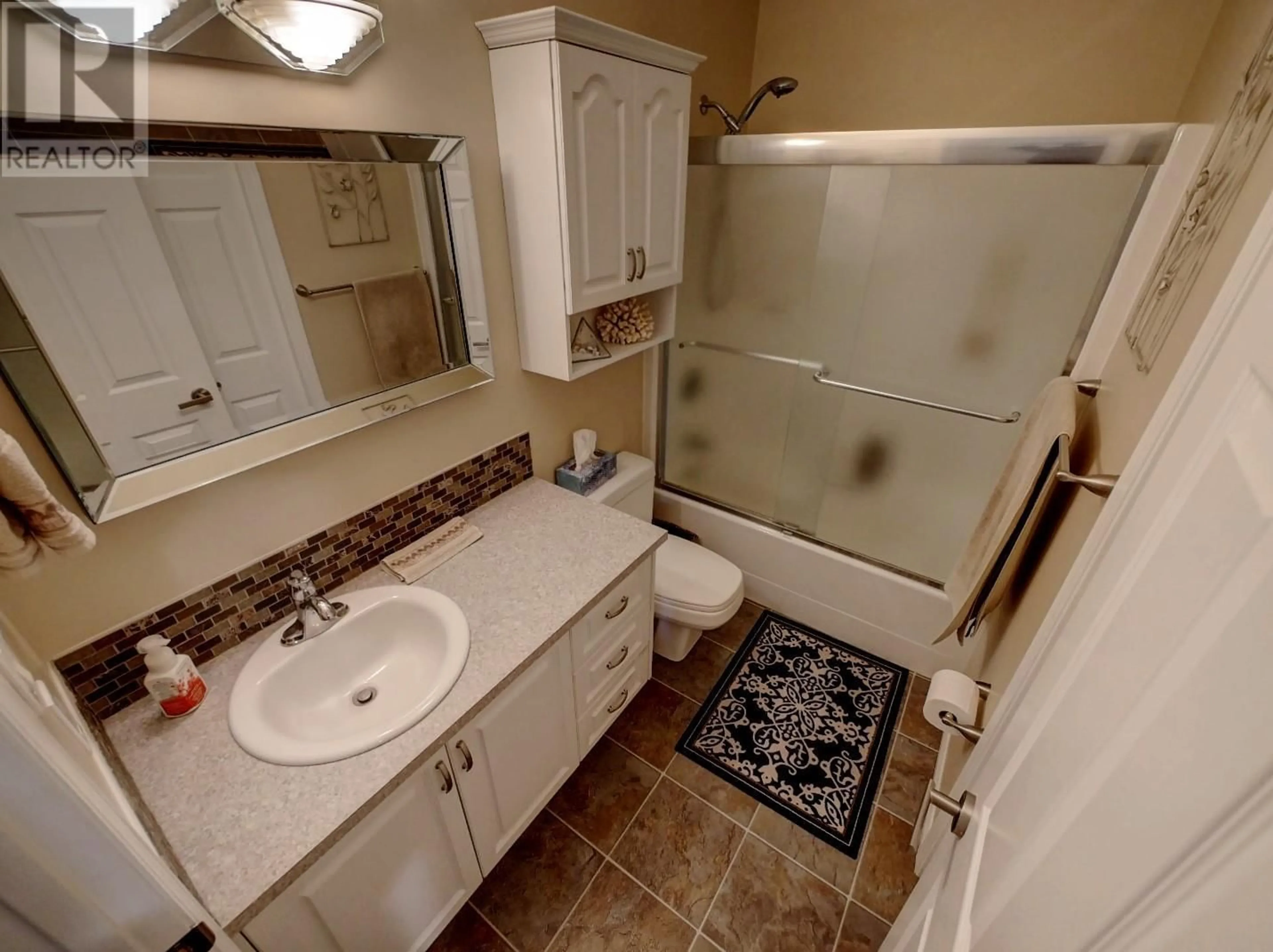 Standard bathroom, ceramic/tile floor for 1910 Leaning Tree Road, Lister British Columbia V0B1G2