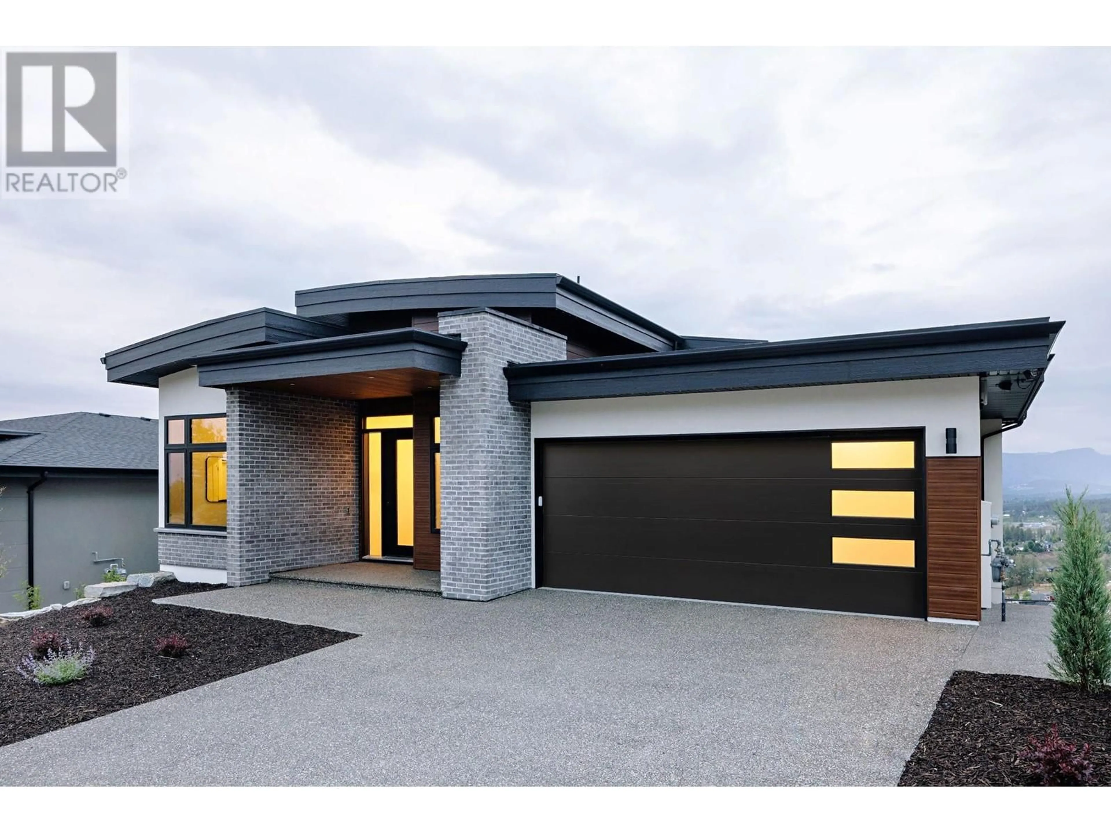Home with brick exterior material, street for 1050 EMSLIE STREET, Kelowna British Columbia V1W0C3