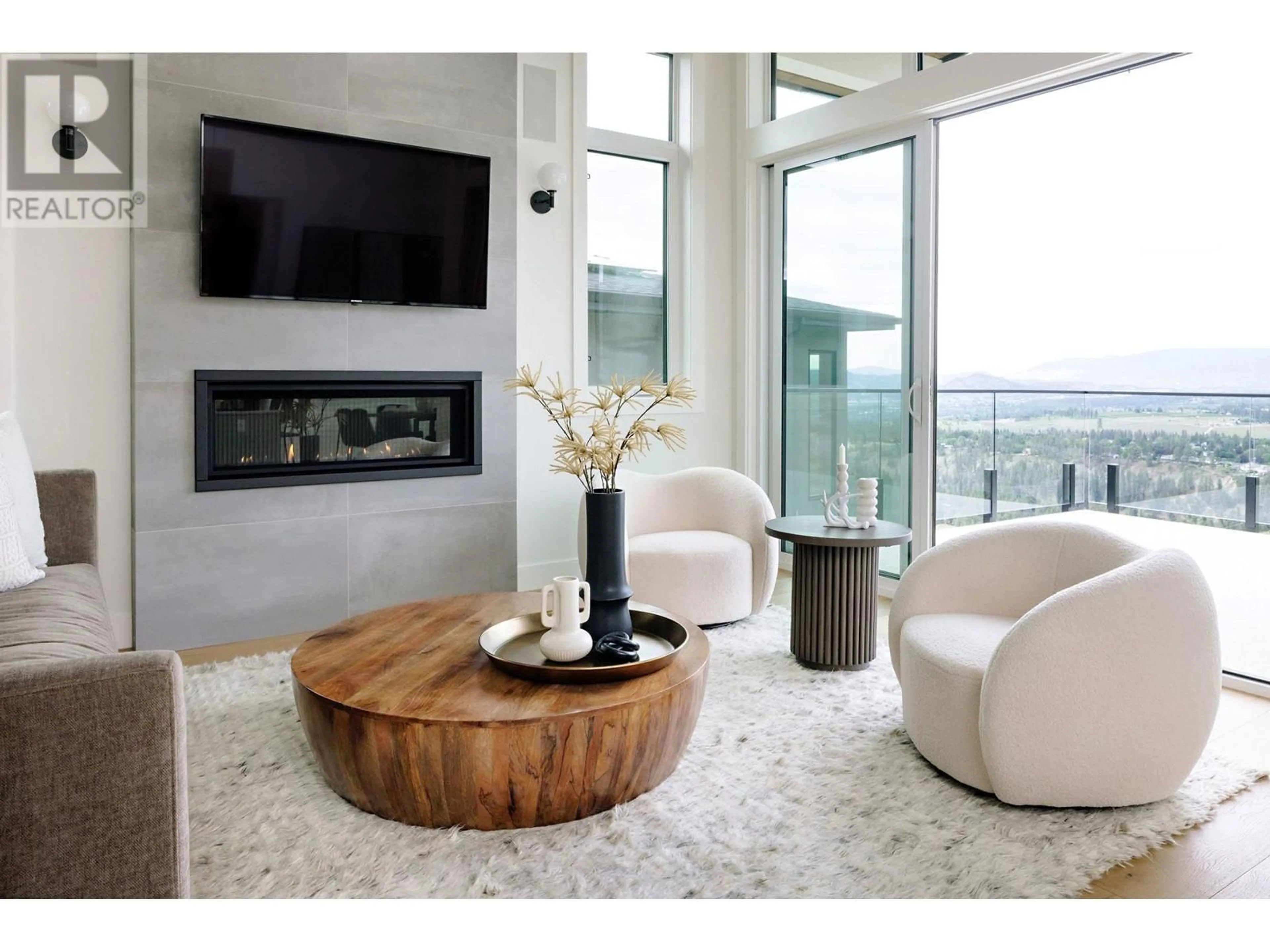 Living room with furniture, wood/laminate floor for 1050 EMSLIE STREET, Kelowna British Columbia V1W0C3