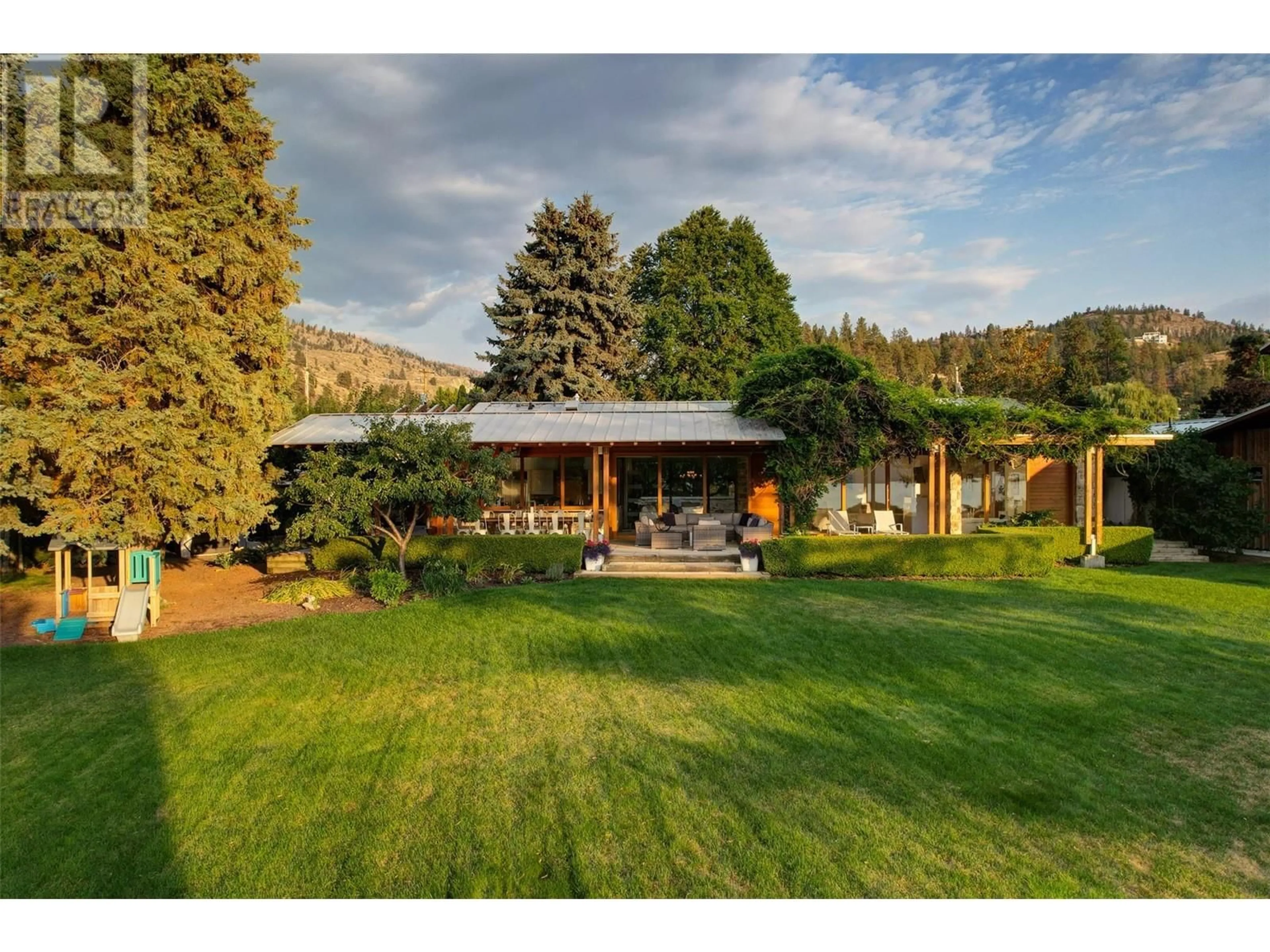 A pic from outside/outdoor area/front of a property/back of a property/a pic from drone, mountain view for 106 DEVON DRIVE, Okanagan Falls British Columbia V0H1R5