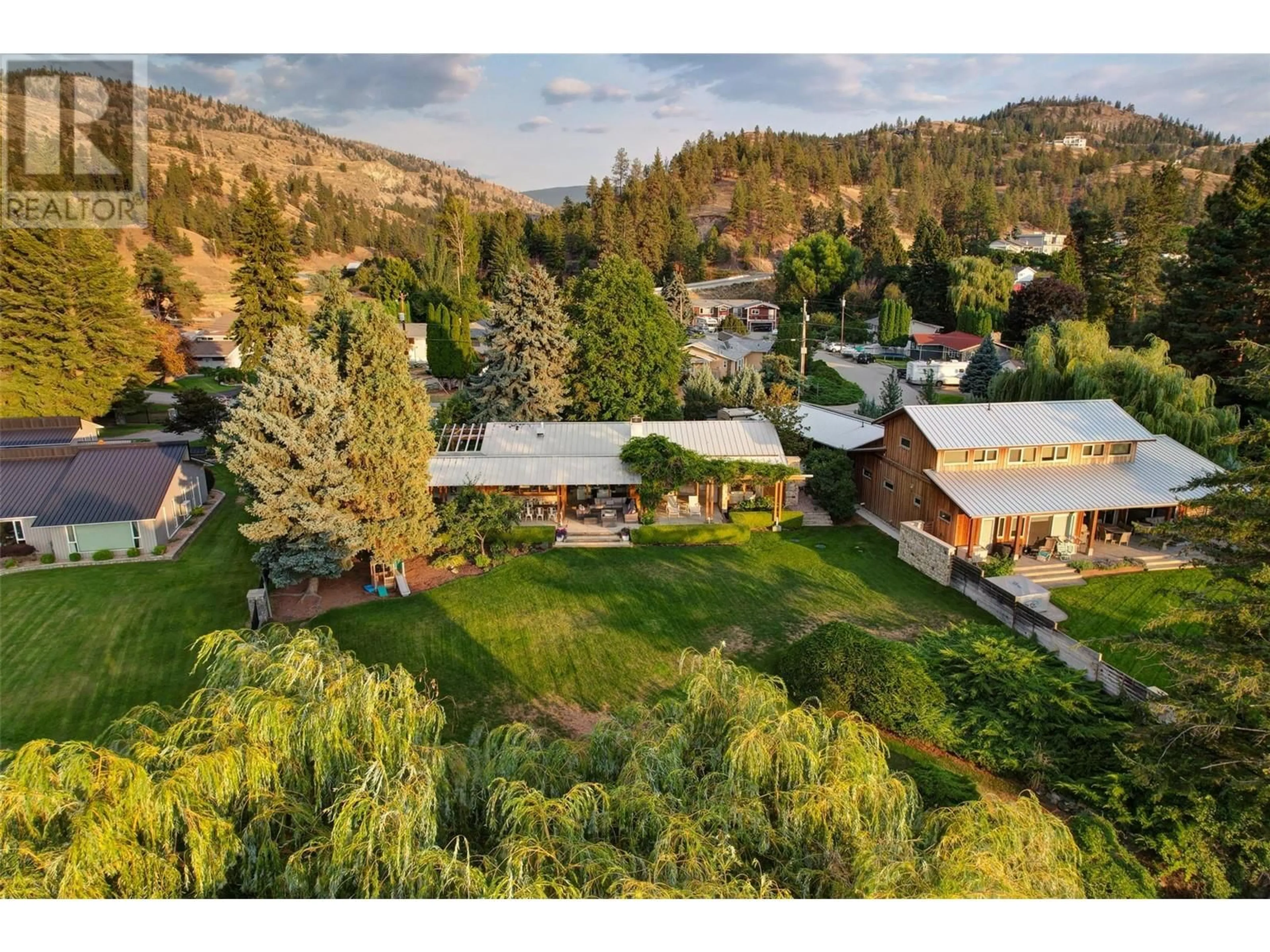 A pic from outside/outdoor area/front of a property/back of a property/a pic from drone, mountain view for 106 DEVON DRIVE, Okanagan Falls British Columbia V0H1R5