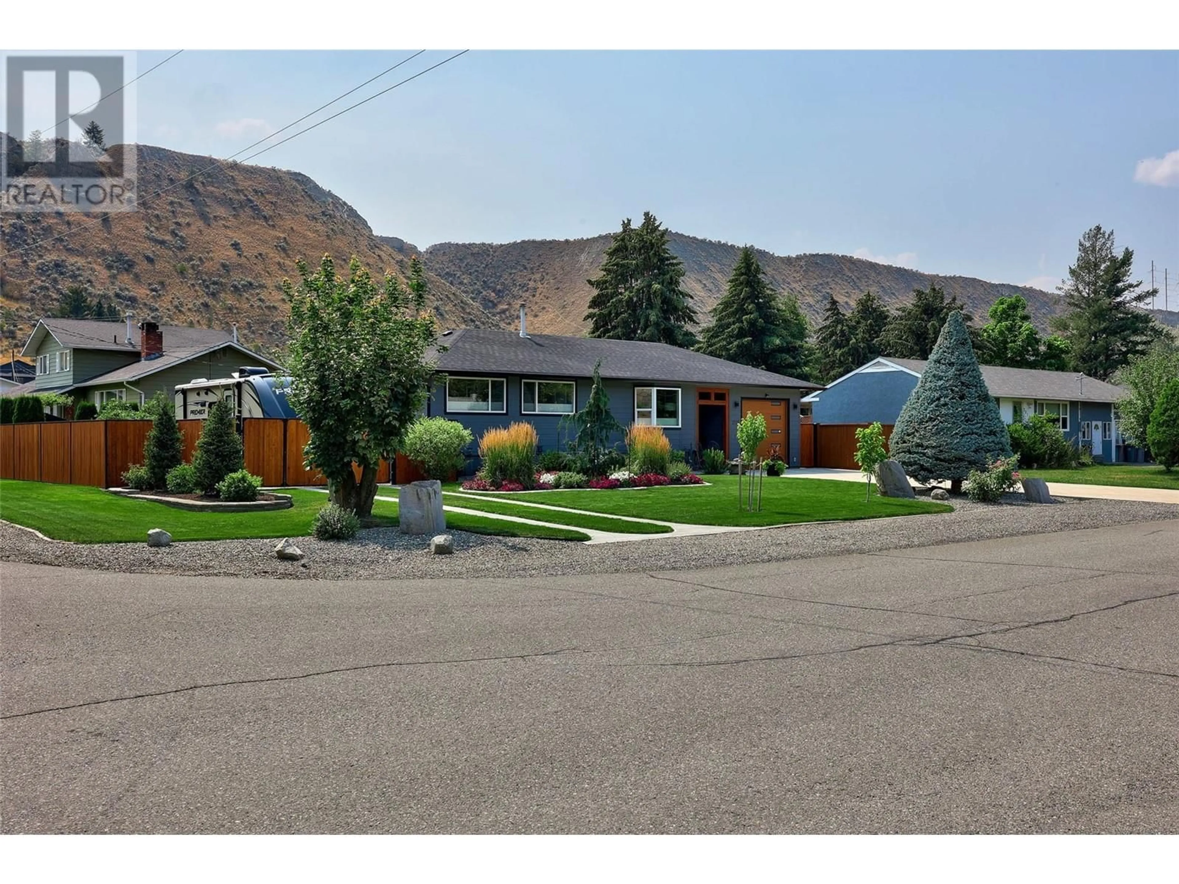 Home with vinyl exterior material, mountain view for 2025 Glenwood Drive, Kamloops British Columbia V2C4G5