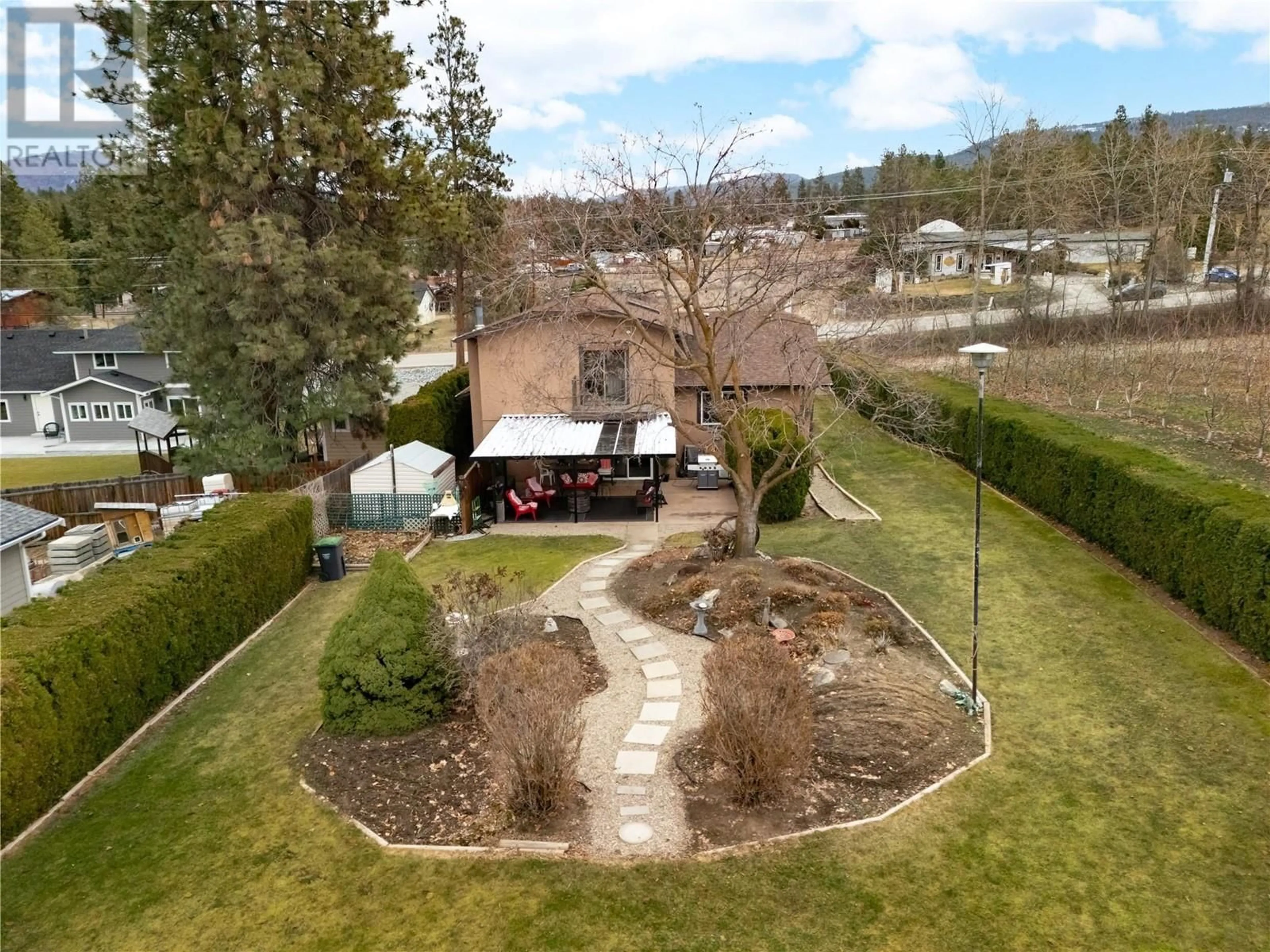 A pic from outside/outdoor area/front of a property/back of a property/a pic from drone, water/lake/river/ocean view for 3970 JUNE SPRINGS ROAD, Kelowna British Columbia V1W4E4