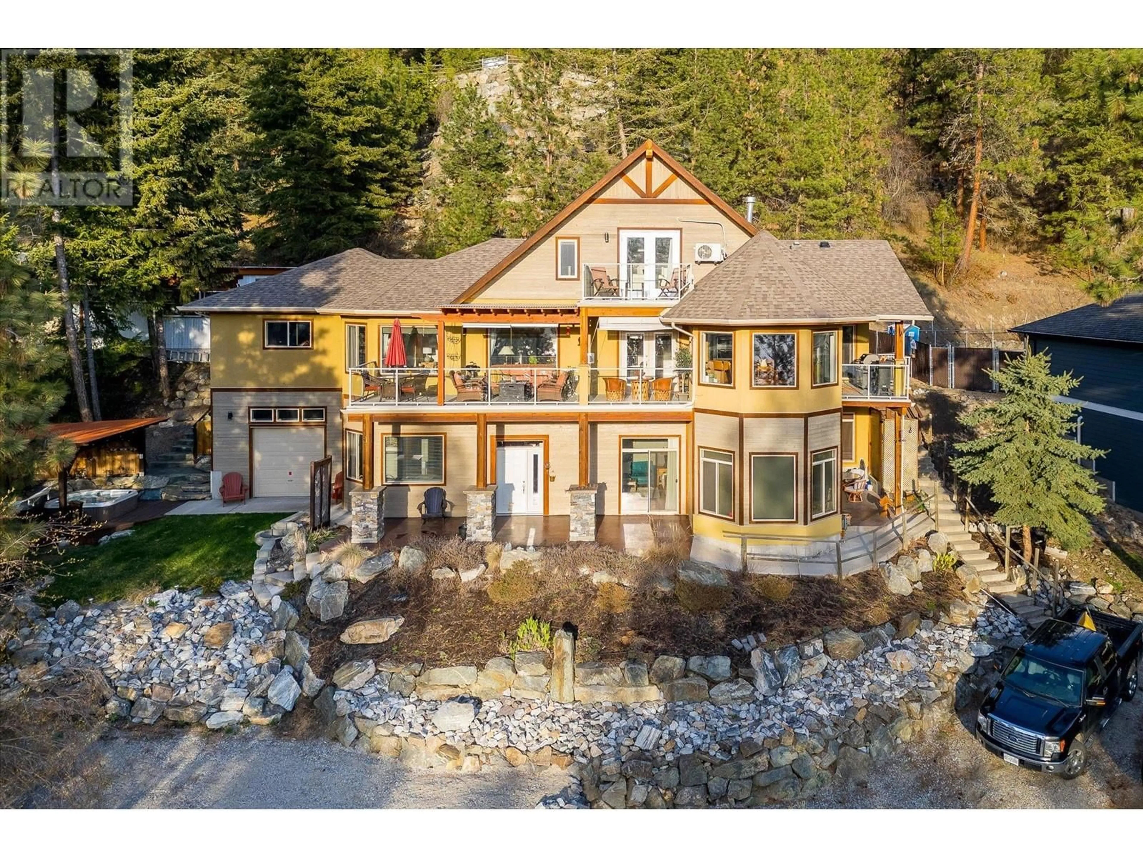 A pic from outside/outdoor area/front of a property/back of a property/a pic from drone, water/lake/river/ocean view for 9143 Tronson Road, Vernon British Columbia V1H1E2