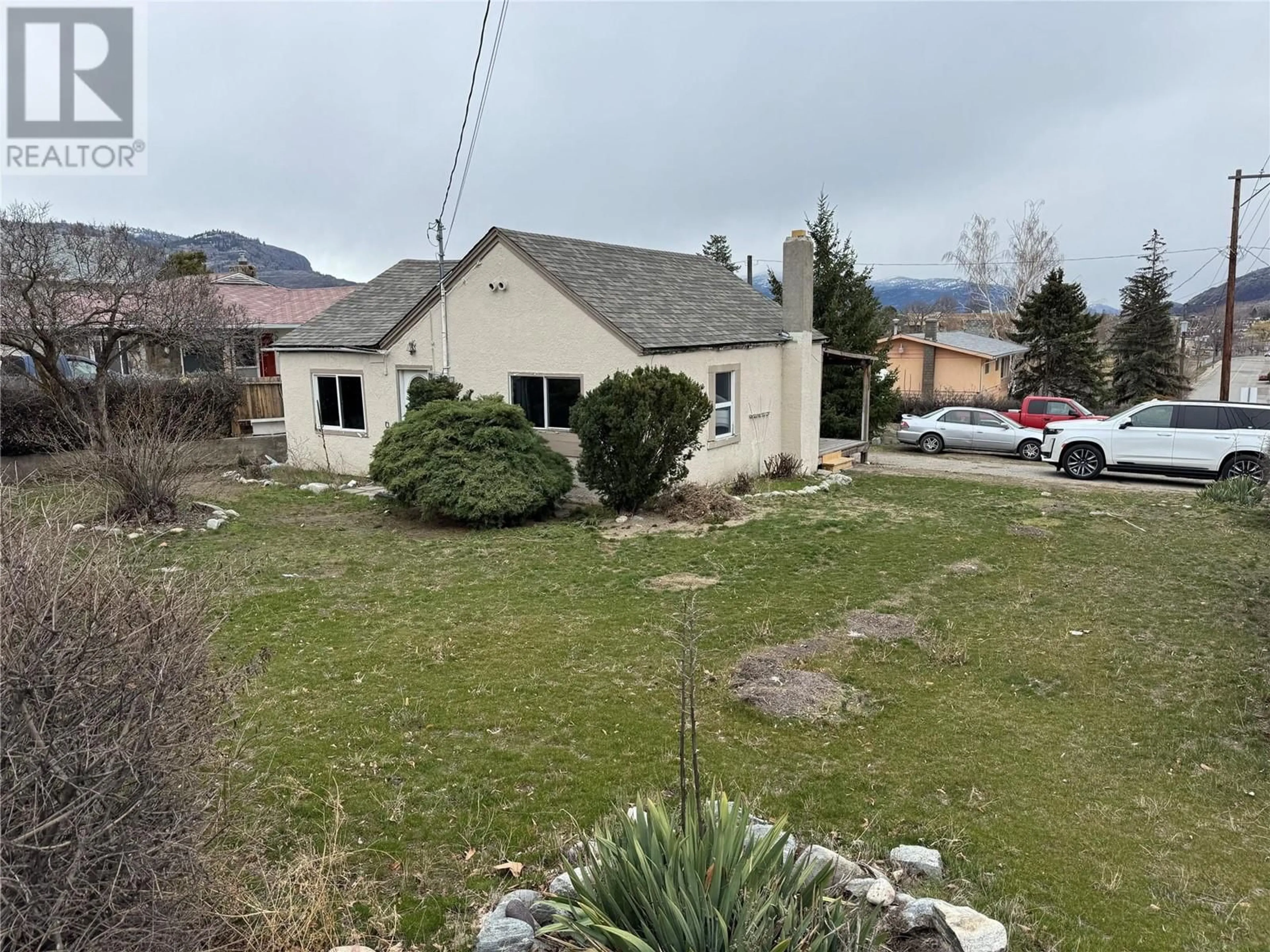 A pic from outside/outdoor area/front of a property/back of a property/a pic from drone, mountain view for 8709 74TH AVENUE, Osoyoos British Columbia V0H1V0
