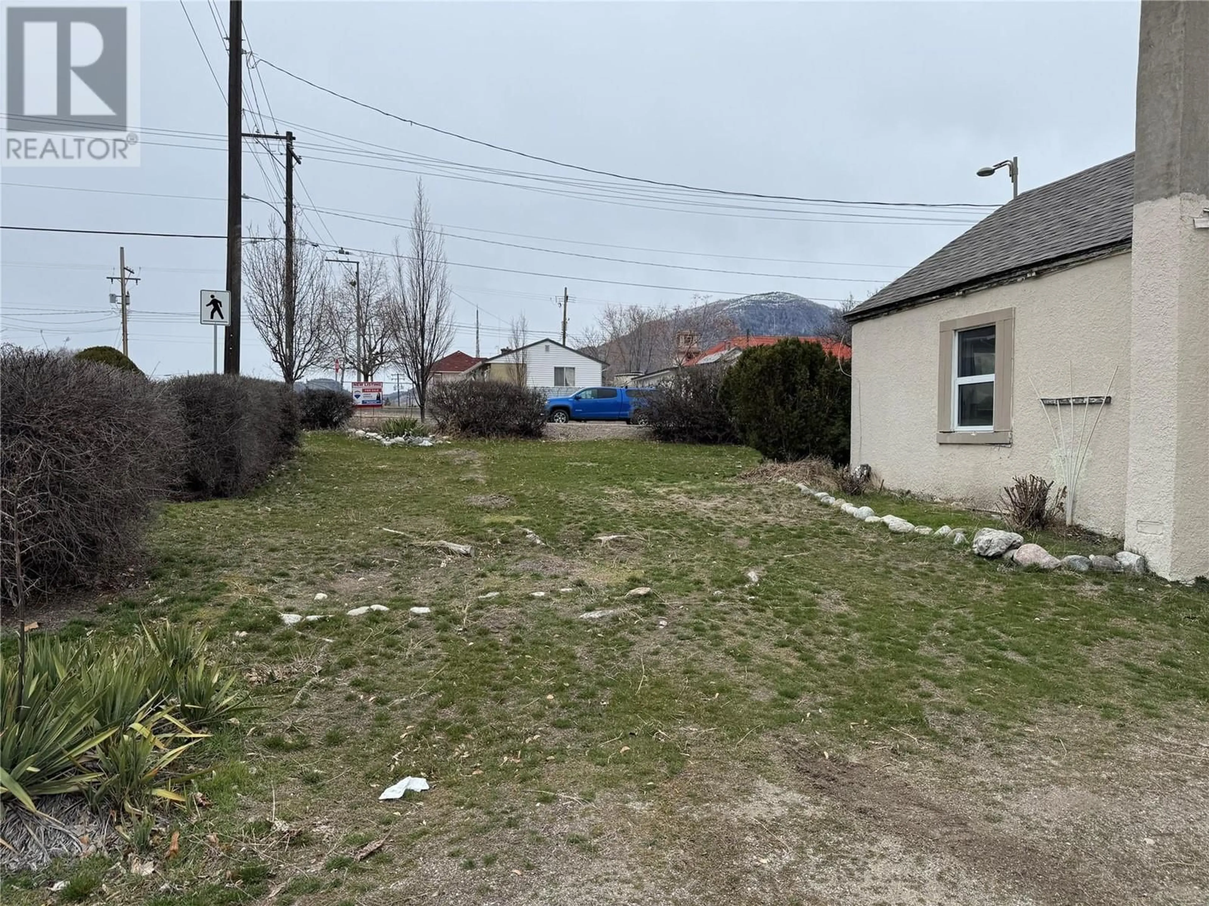 A pic from outside/outdoor area/front of a property/back of a property/a pic from drone, mountain view for 8709 74TH AVENUE, Osoyoos British Columbia V0H1V0