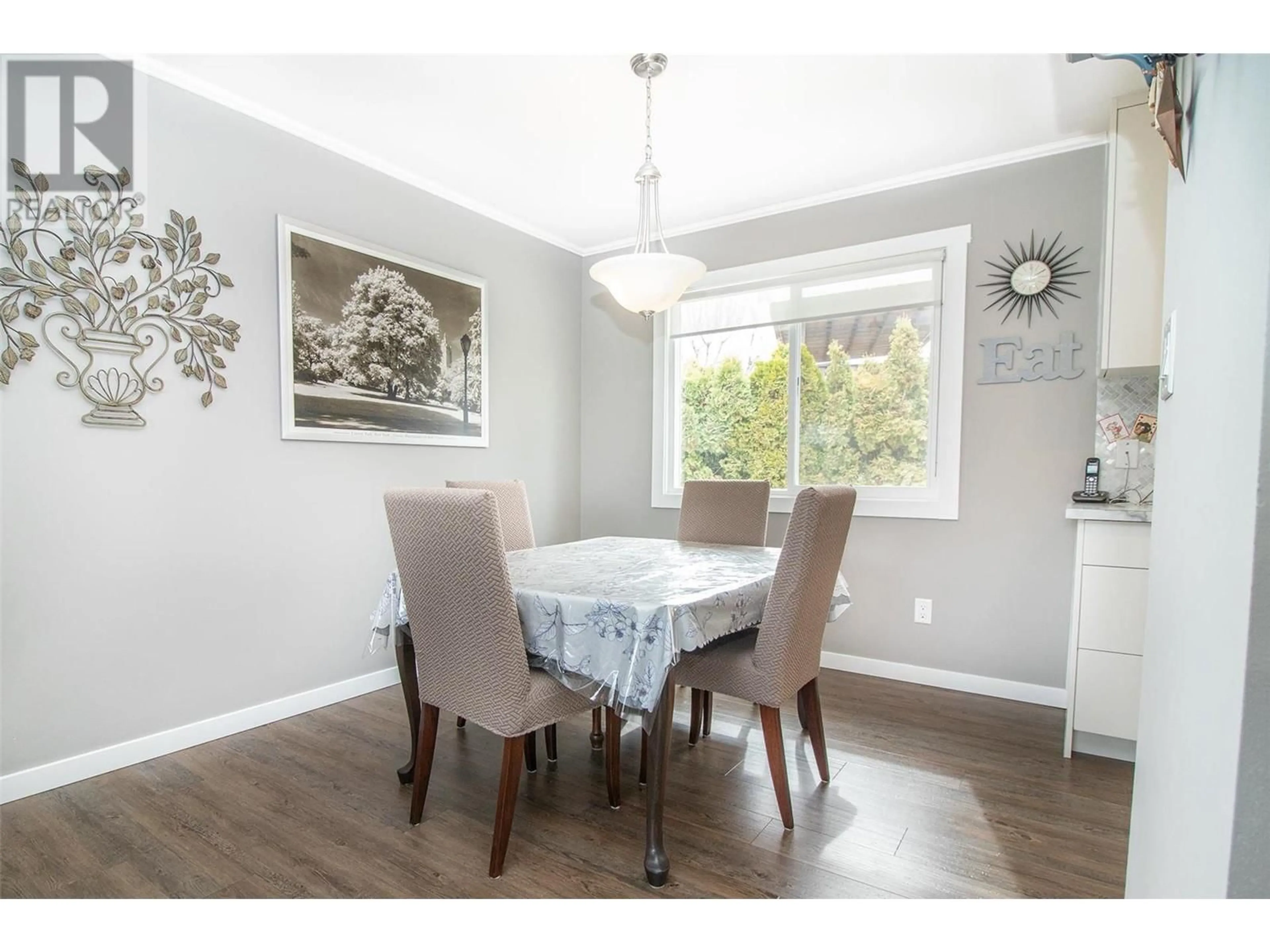 Dining room, wood/laminate floor for 295 VENUS ROAD, Kelowna British Columbia V1X1H6