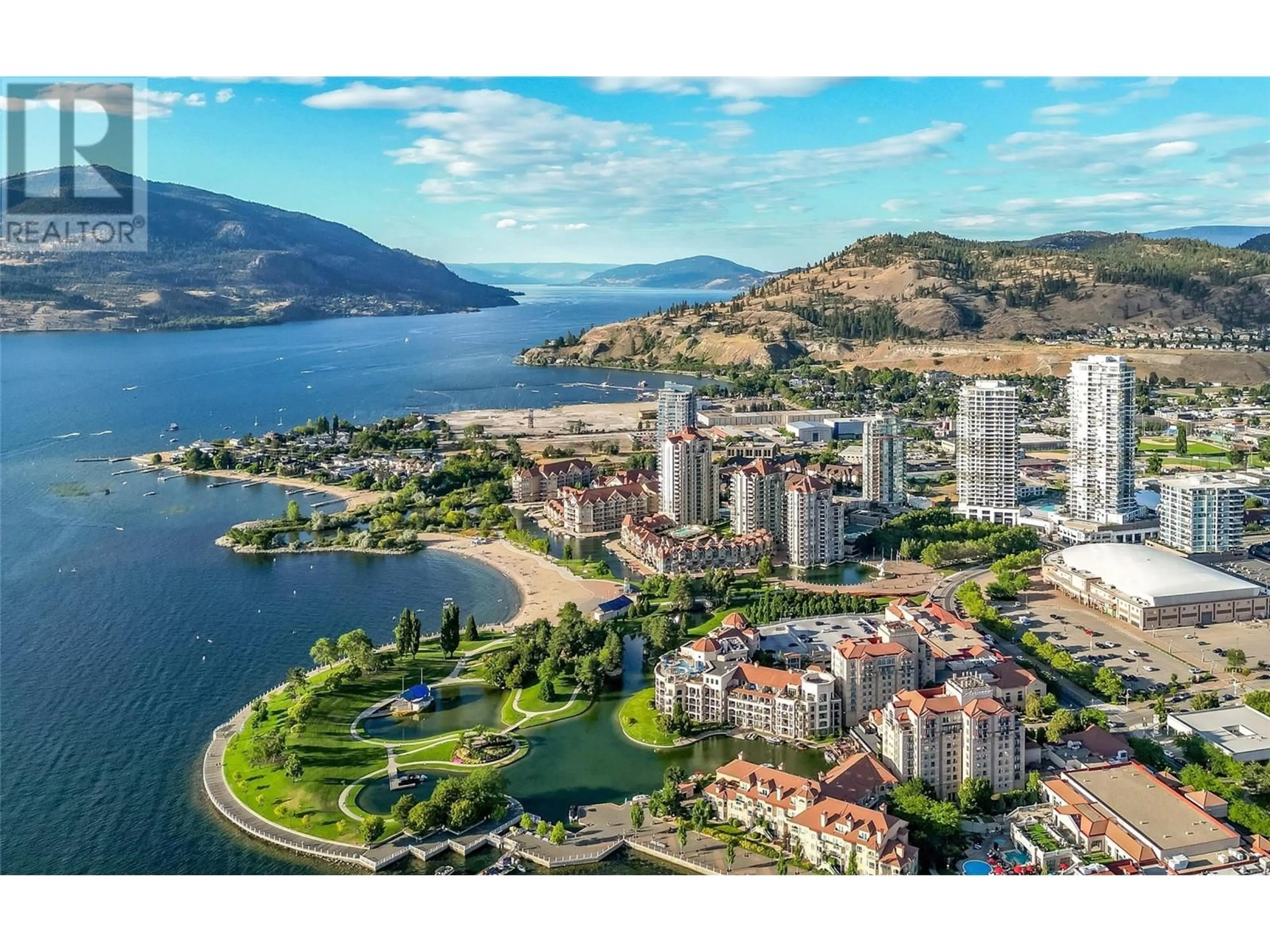 A pic from outside/outdoor area/front of a property/back of a property/a pic from drone, water/lake/river/ocean view for TH103 - 1151 SUNSET DRIVE, Kelowna British Columbia V1Y0G2