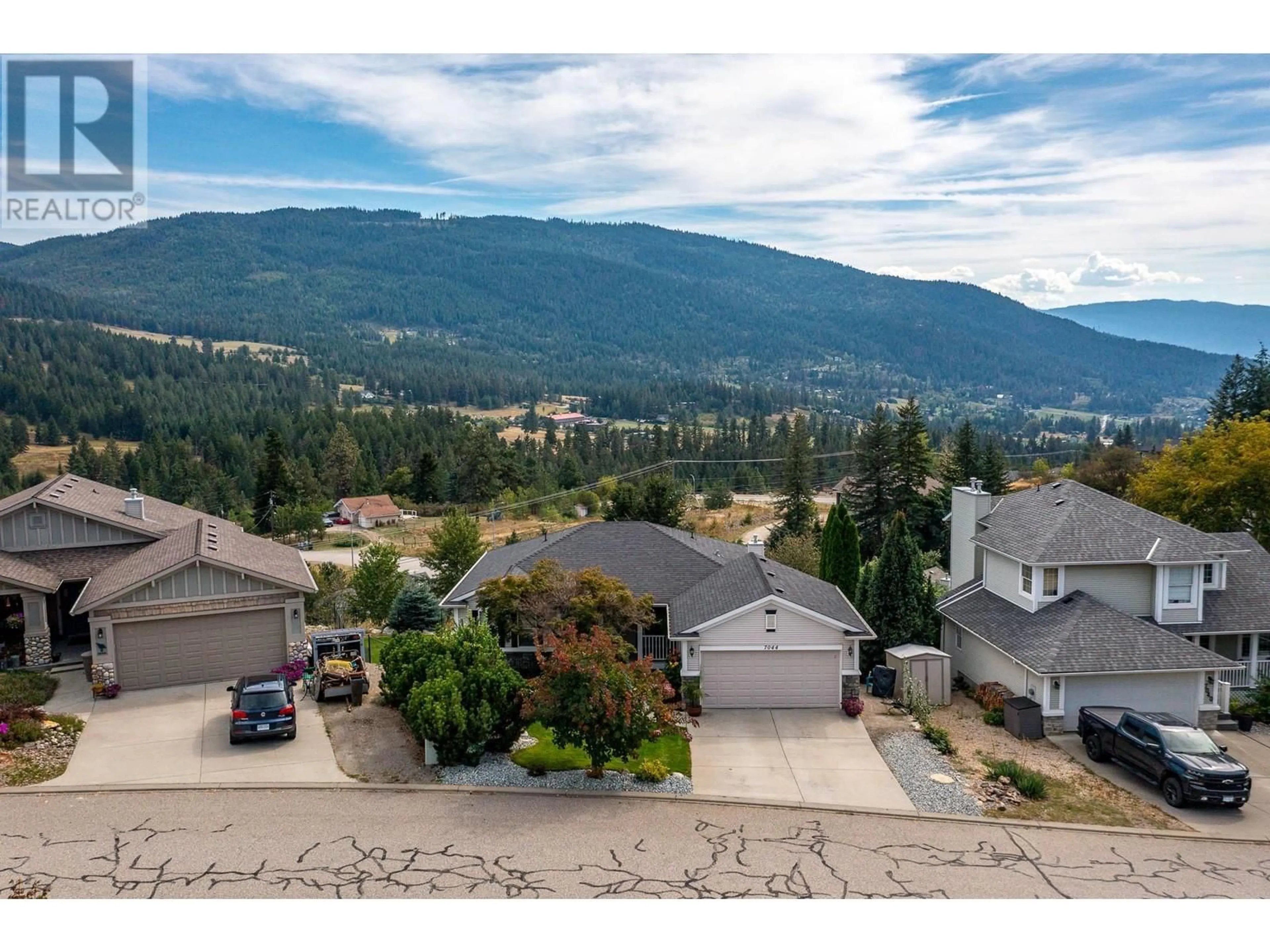 A pic from outside/outdoor area/front of a property/back of a property/a pic from drone, mountain view for 7044 NAKISKA DRIVE, Vernon British Columbia V1B3M5