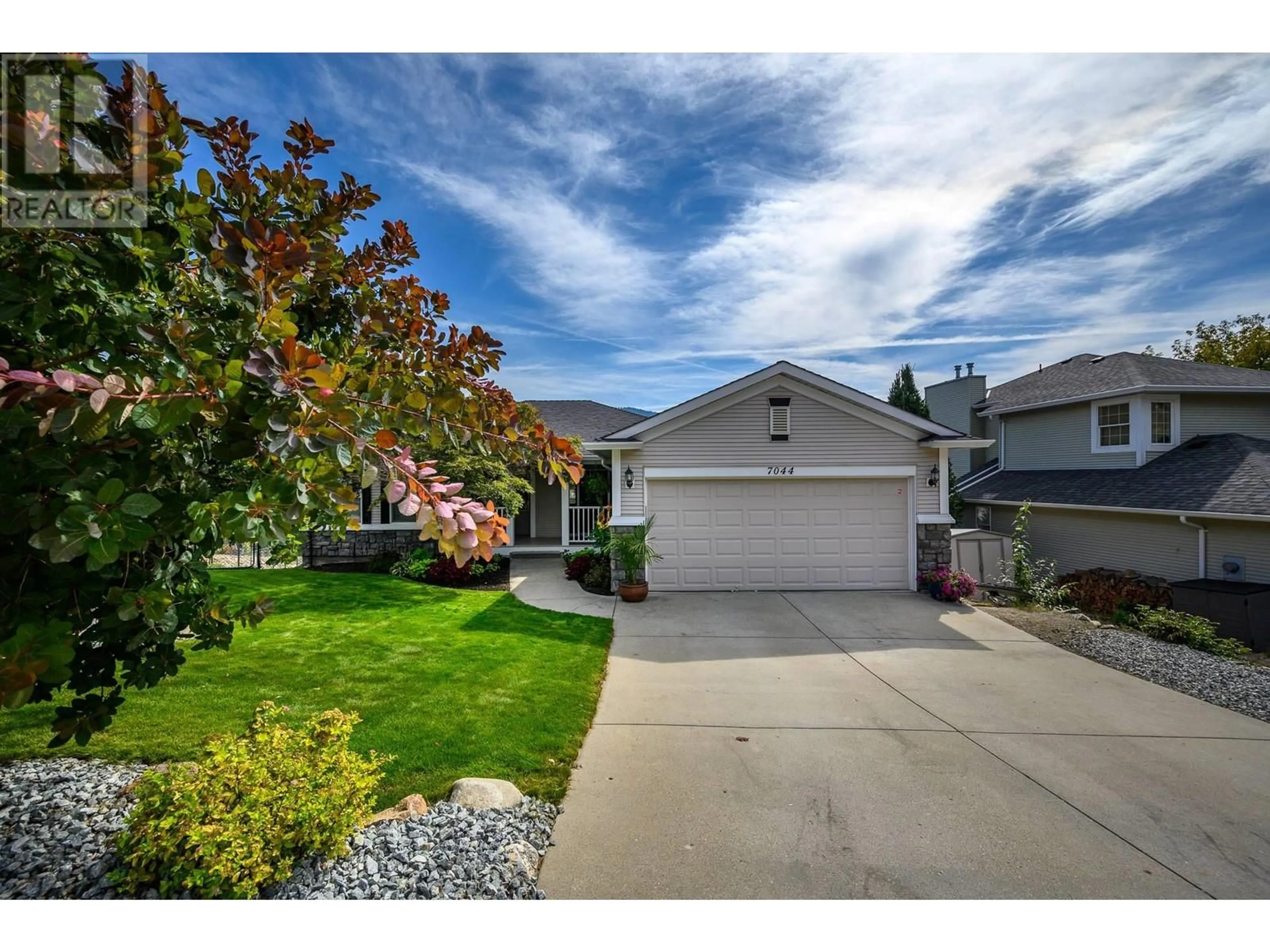 A pic from outside/outdoor area/front of a property/back of a property/a pic from drone, street for 7044 NAKISKA DRIVE, Vernon British Columbia V1B3M5