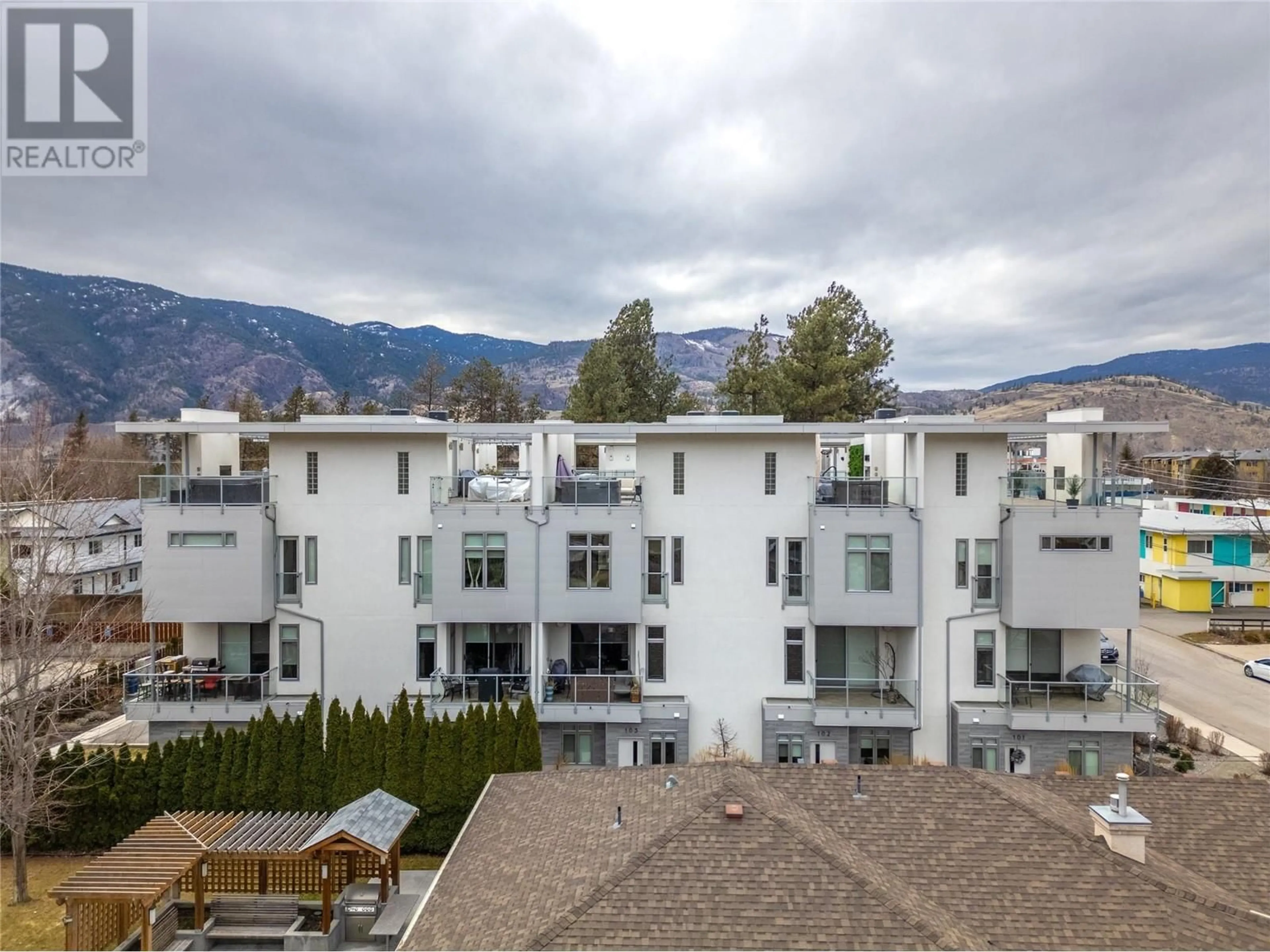 A pic from outside/outdoor area/front of a property/back of a property/a pic from drone, mountain view for 222 Lee Avenue Unit# 103, Penticton British Columbia V2A0G2