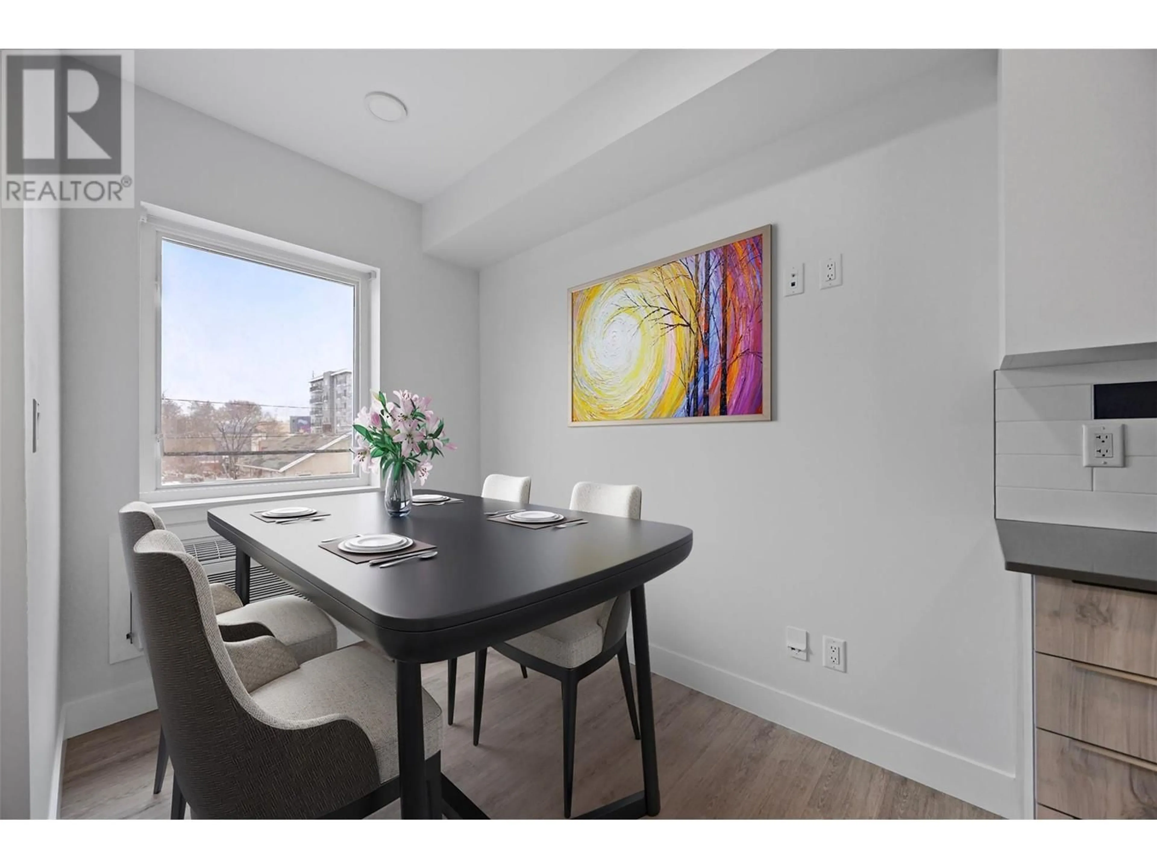 Dining room, wood/laminate floor for 206 - 107 YEW STREET, Kamloops British Columbia V2B4A1