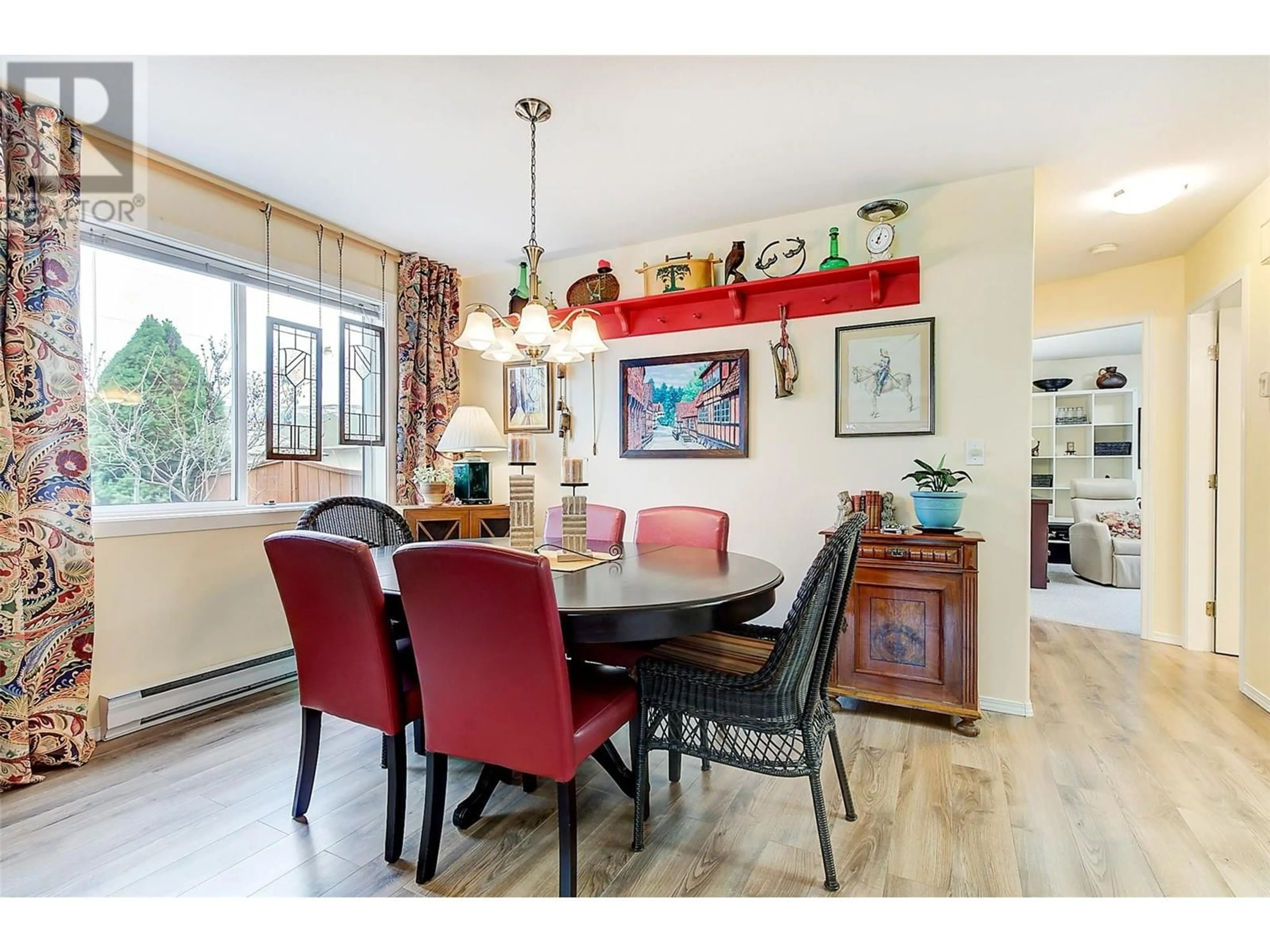 Dining room, wood/laminate floor for 2209 STILLINGFLEET COURT, Kelowna British Columbia V1Y9N3