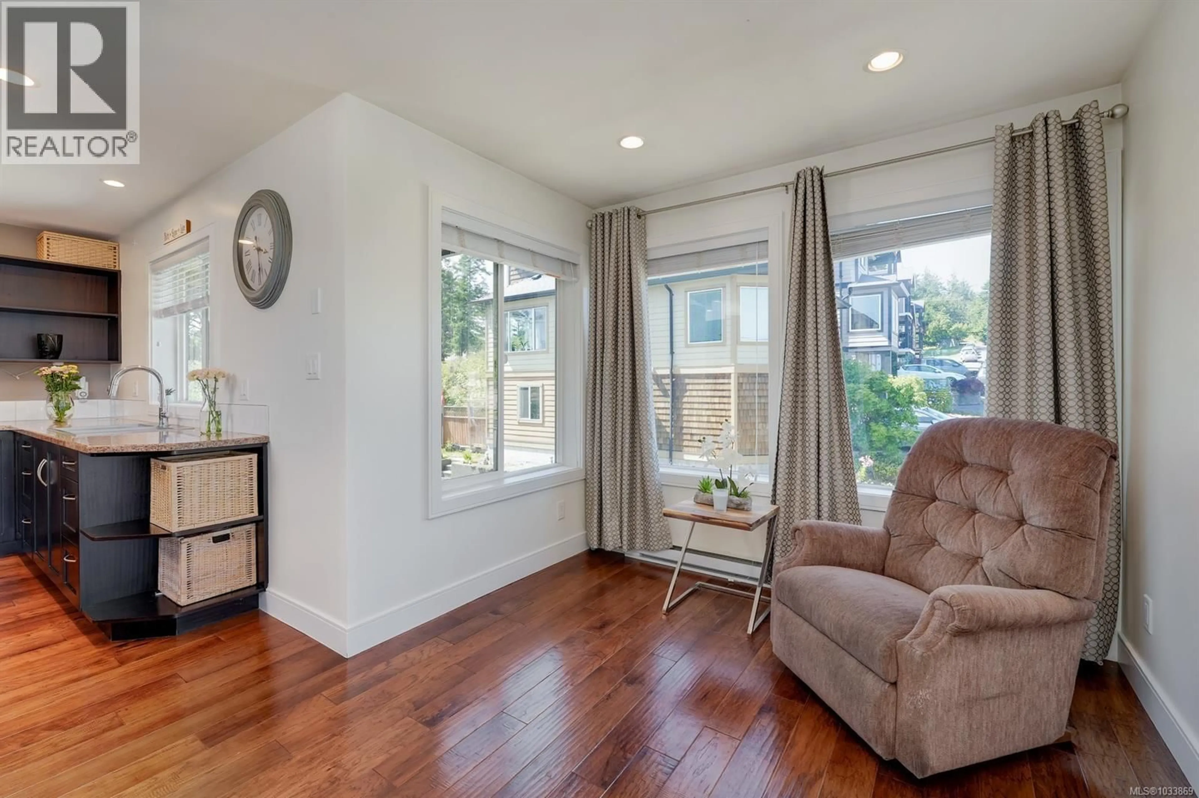 Living room with furniture, wood/laminate floor for 101 - 7091 GRANT ROAD WEST, Sooke British Columbia V9Z0N6