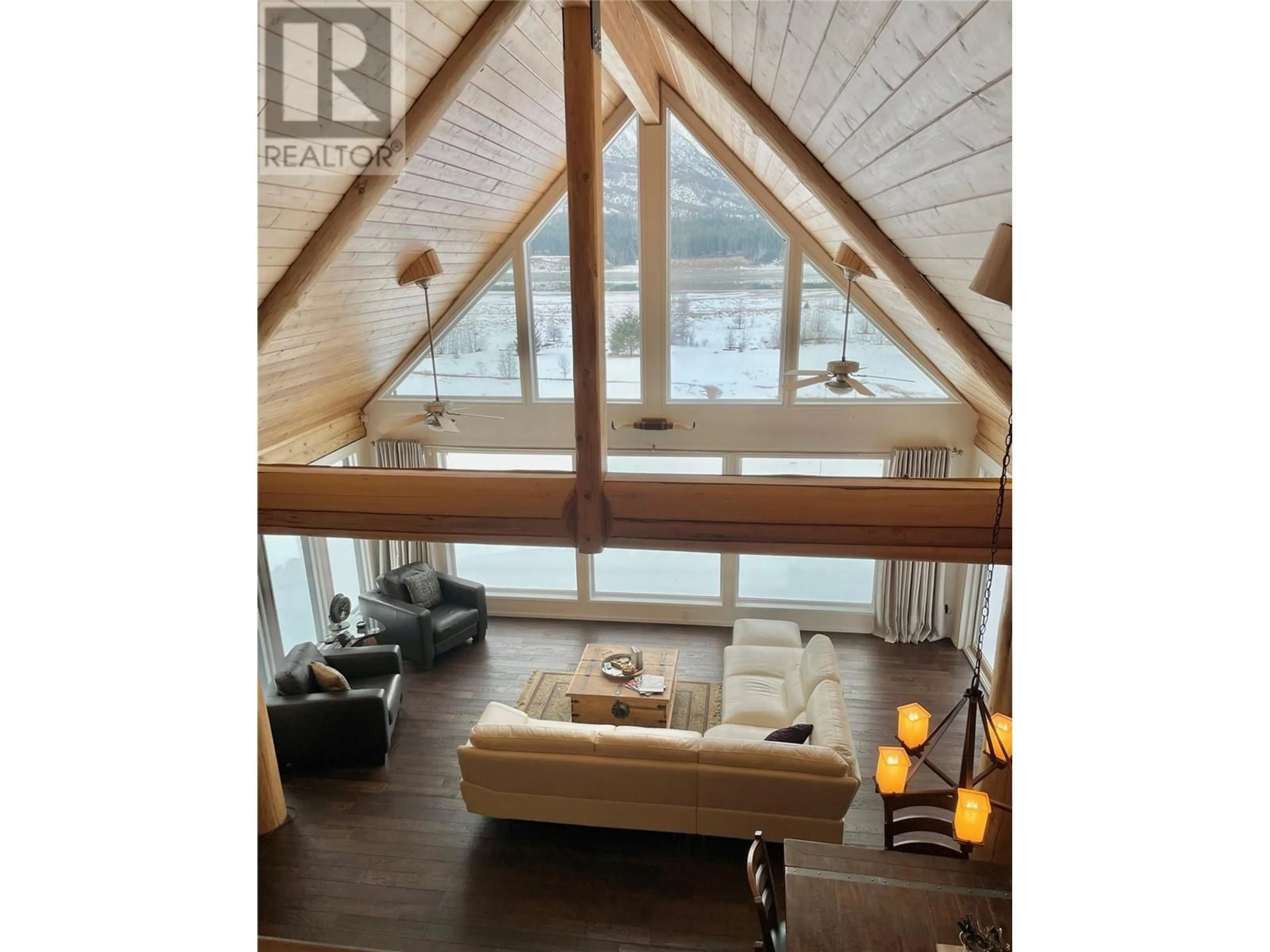 Living room with furniture, wood/laminate floor for 4210 MOLE Road, Burton British Columbia V0G1R0