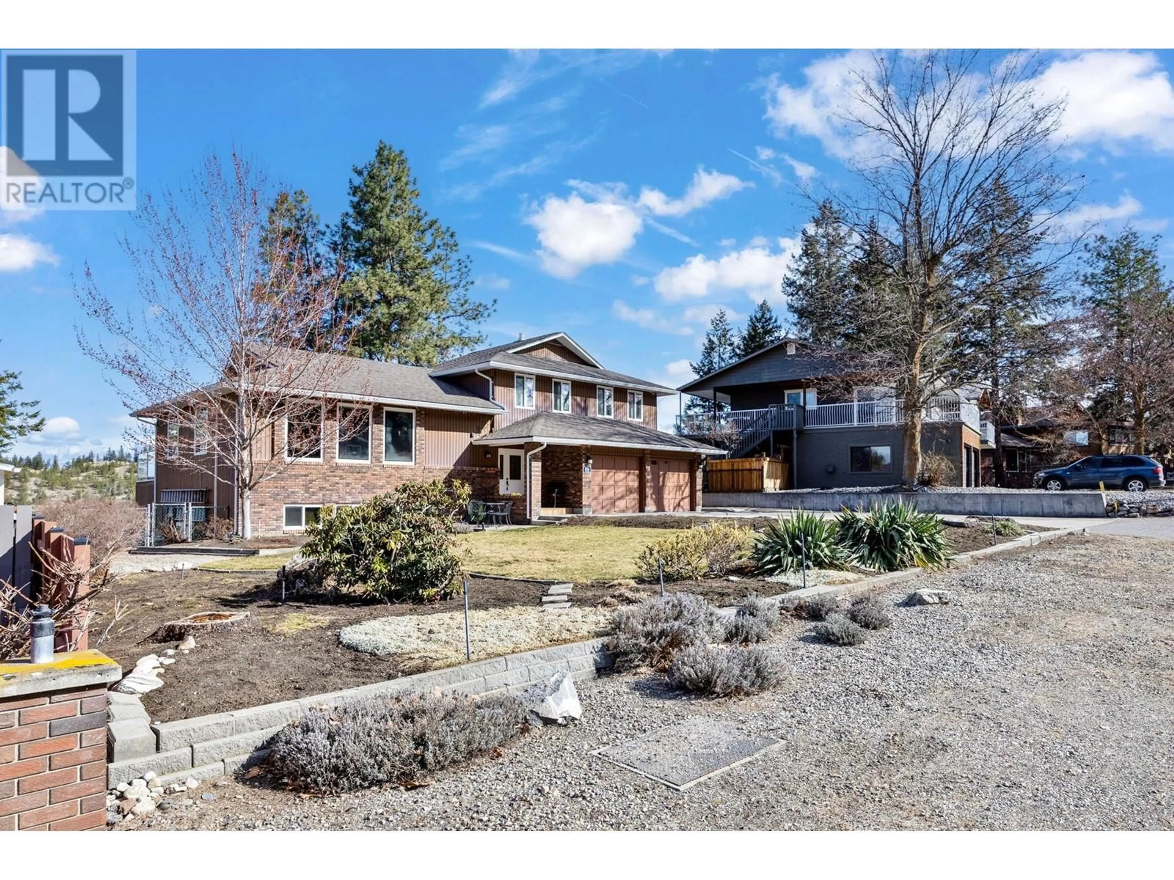 A pic from outside/outdoor area/front of a property/back of a property/a pic from drone, street for 834 Steele Road, Kelowna British Columbia V1W4P1