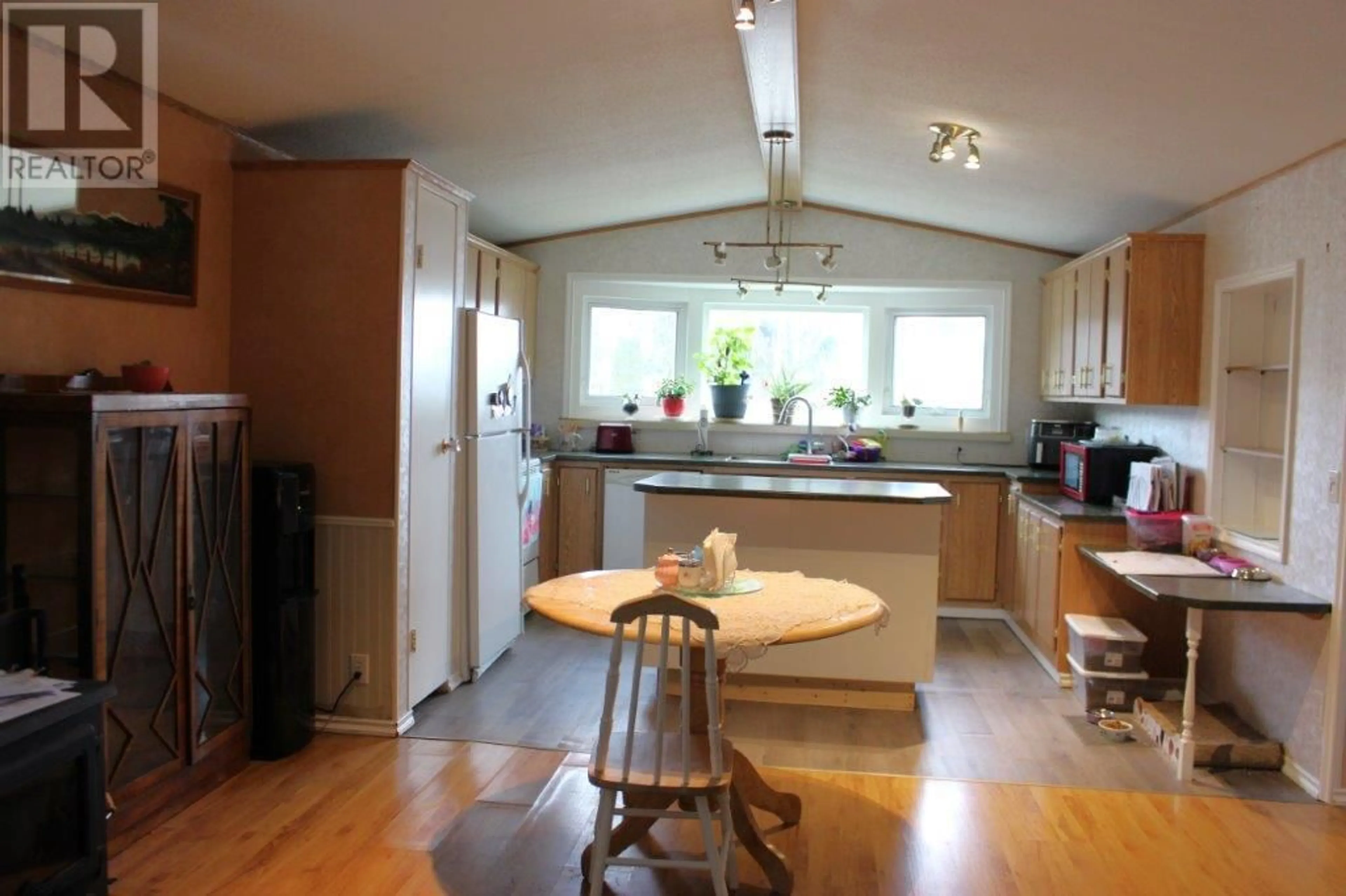 Open concept kitchen, wood/laminate floor for 163 - 715 BEAVER LAKE ROAD, Kelowna British Columbia V4V1E3