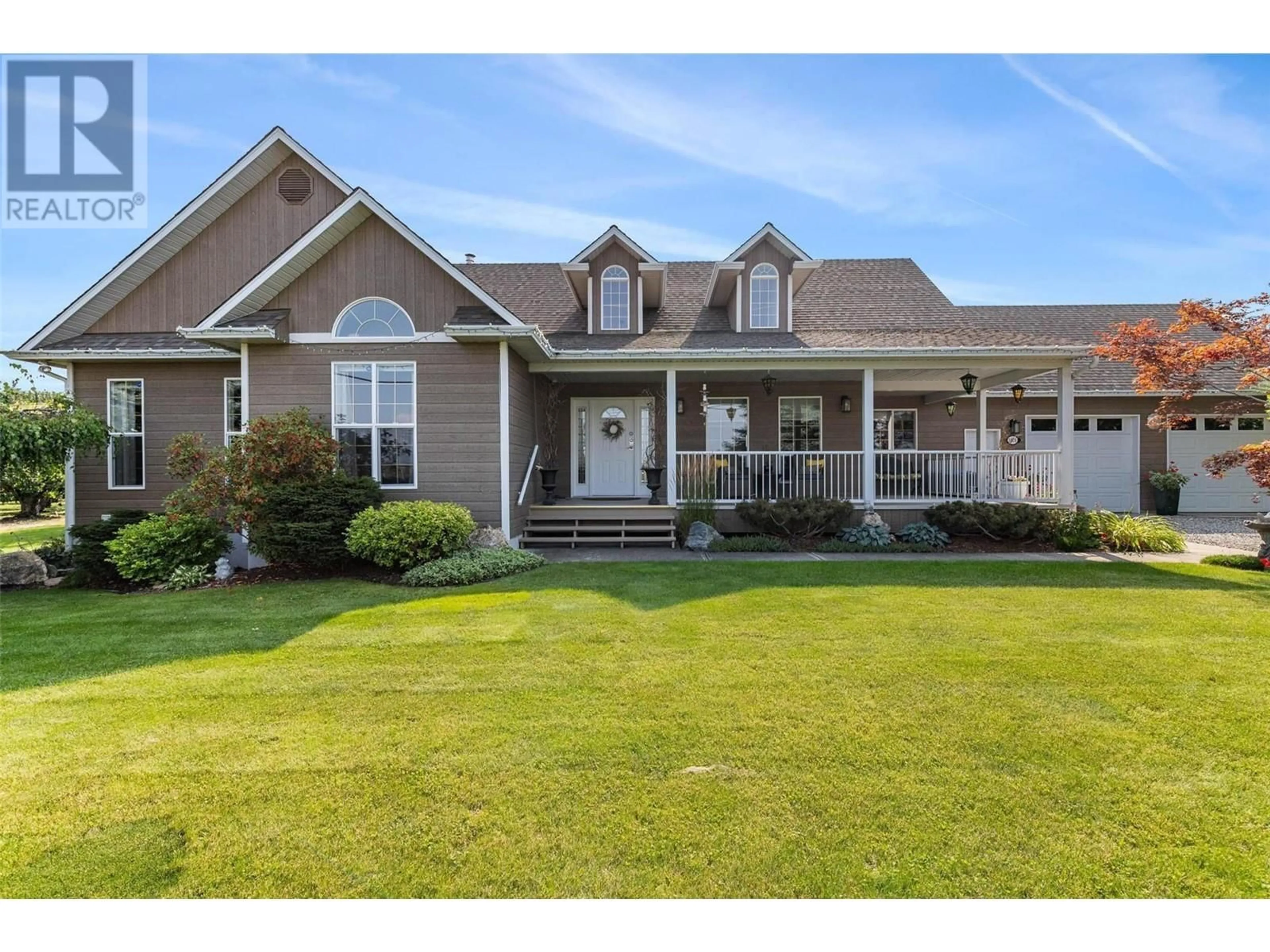 Home with vinyl exterior material, street for 1409 TEASDALE ROAD, Kelowna British Columbia V1P1C8