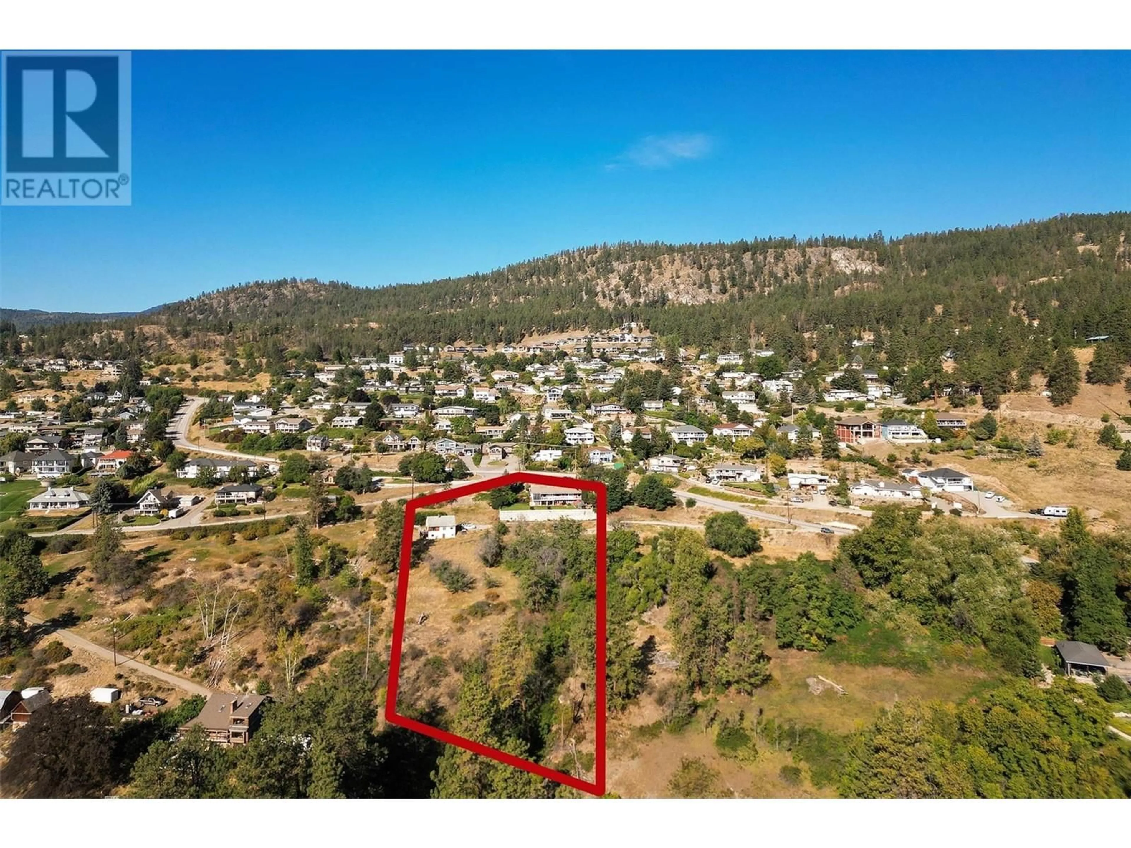 A pic from outside/outdoor area/front of a property/back of a property/a pic from drone, mountain view for 4649 PRINCETON AVENUE, Peachland British Columbia V0H1X7