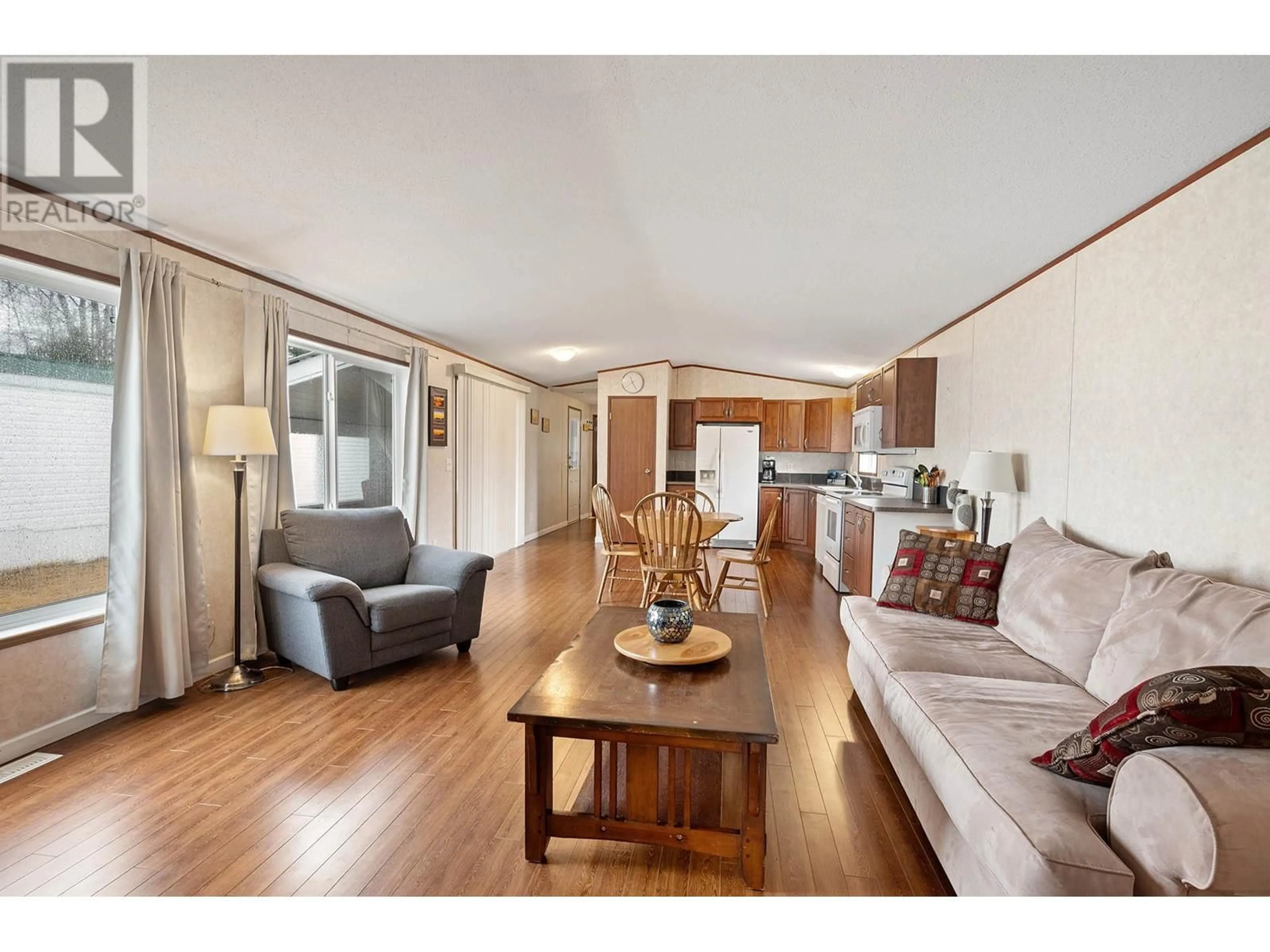 Living room with furniture, wood/laminate floor for 3 - 130 FERRY ROAD, Clearwater British Columbia V0E1N3