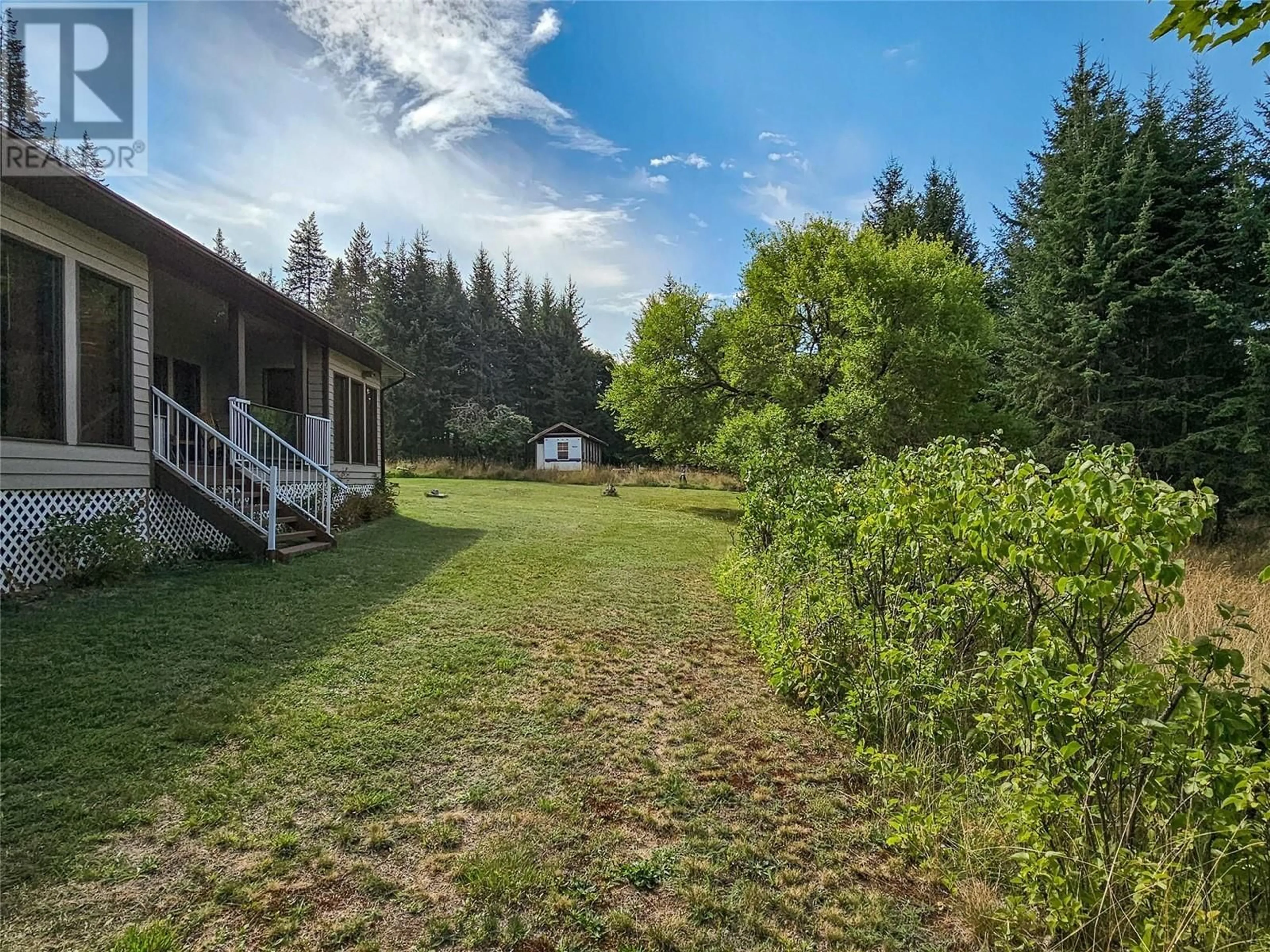 A pic from outside/outdoor area/front of a property/back of a property/a pic from drone, forest/trees view for 1283 RIONDEL Road, Riondel British Columbia V0B2B0