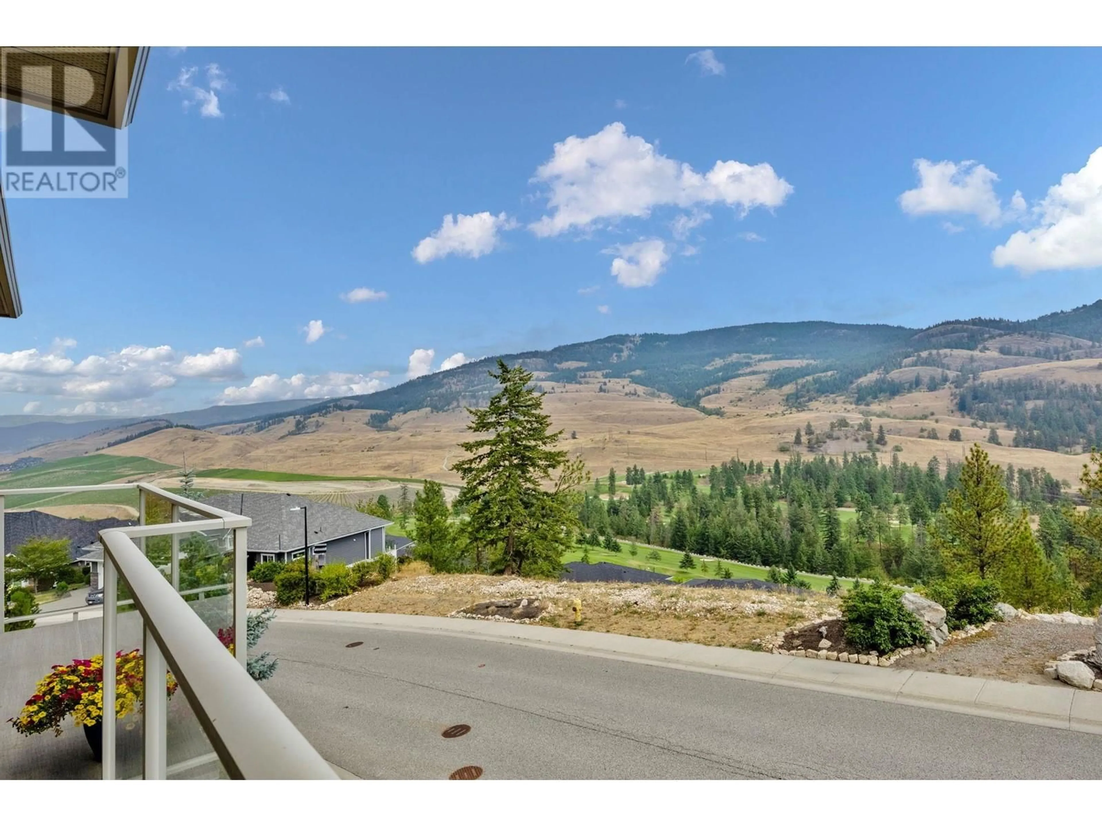 A pic from outside/outdoor area/front of a property/back of a property/a pic from drone, mountain view for 498 CARNOUSTIE DRIVE, Kelowna British Columbia V1P1T1