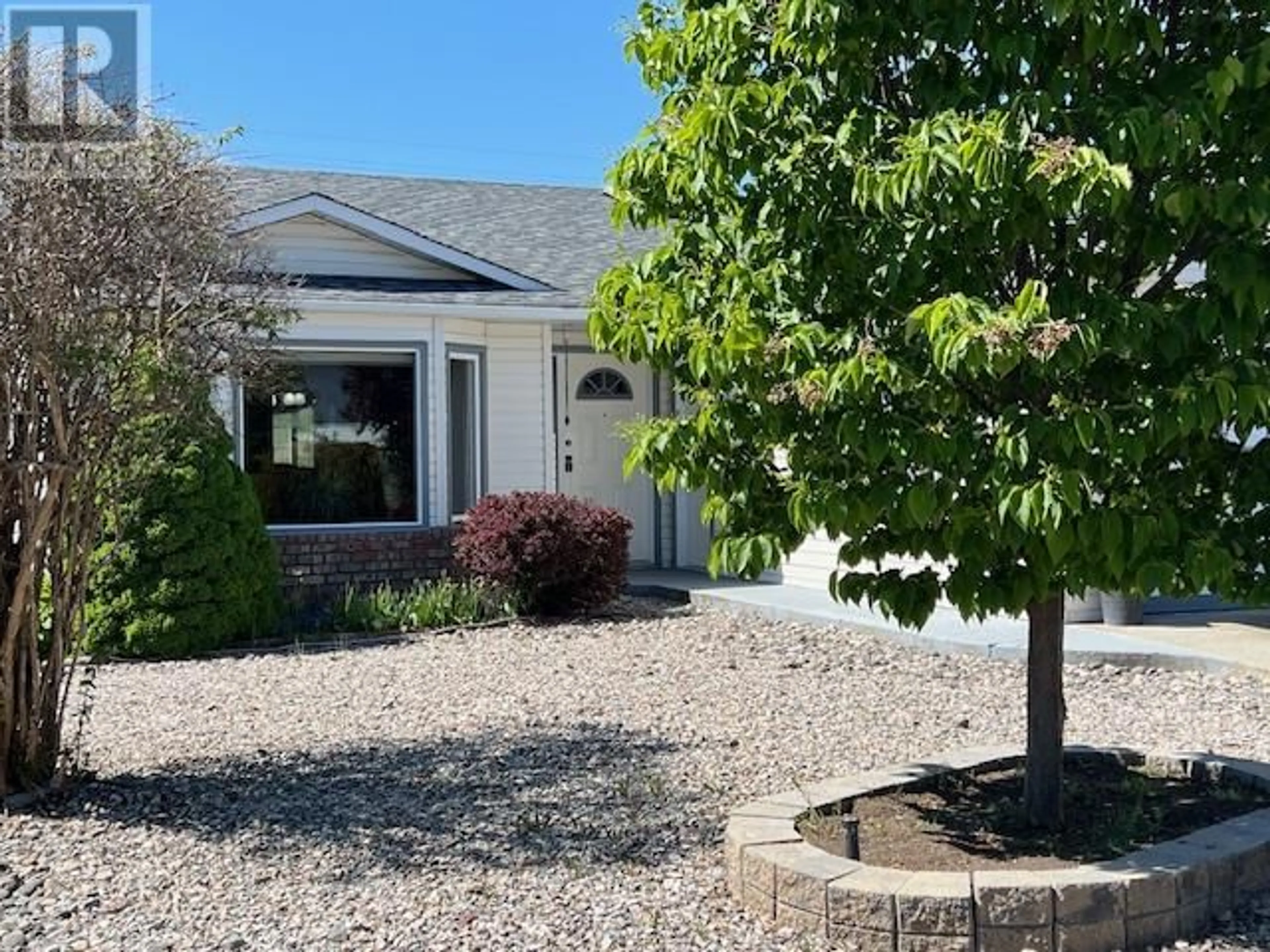 Home with vinyl exterior material, street for 102 1ST STREET, Vernon British Columbia V1H1Z1