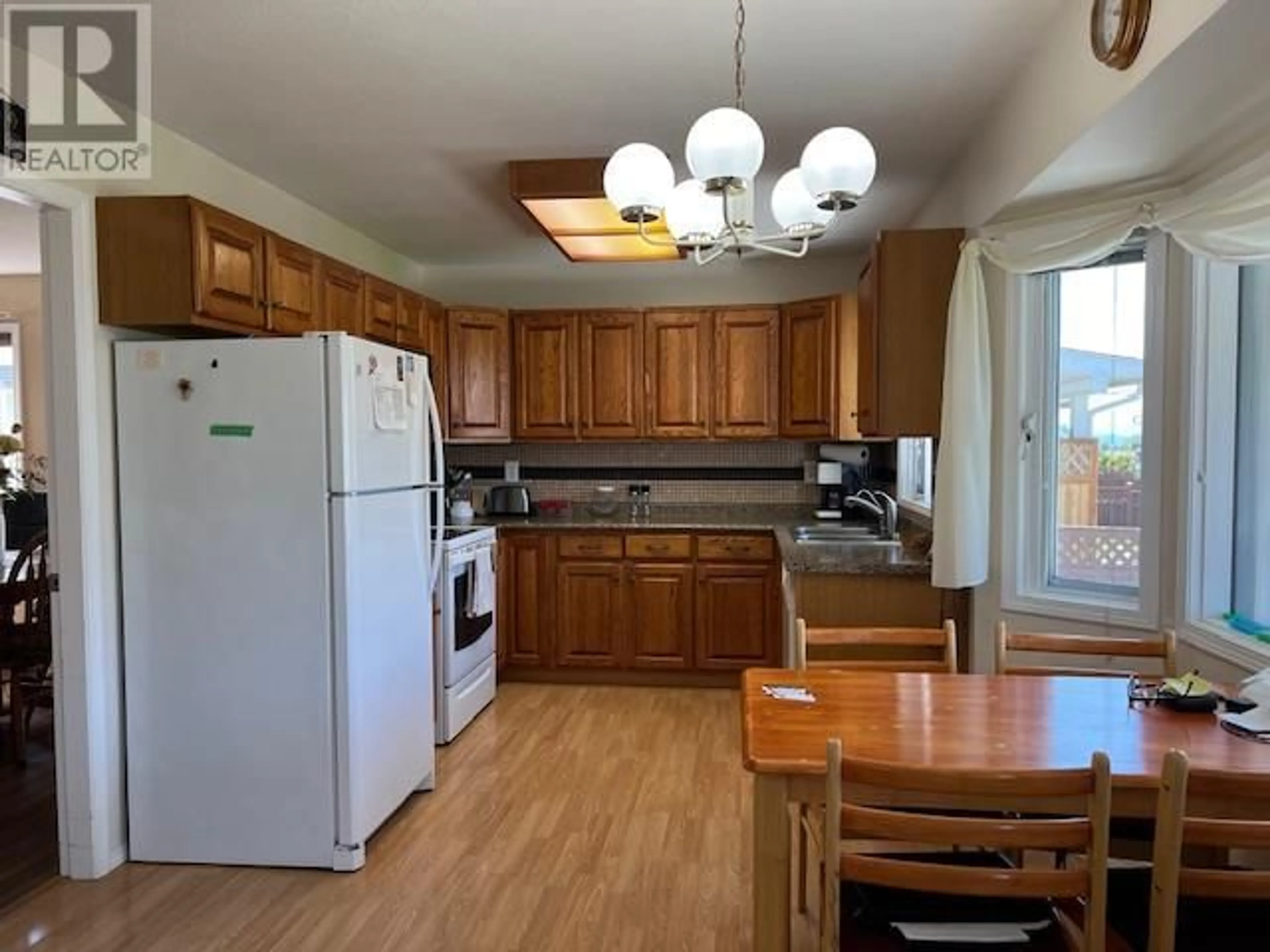 Standard kitchen, wood/laminate floor for 102 1ST STREET, Vernon British Columbia V1H1Z1