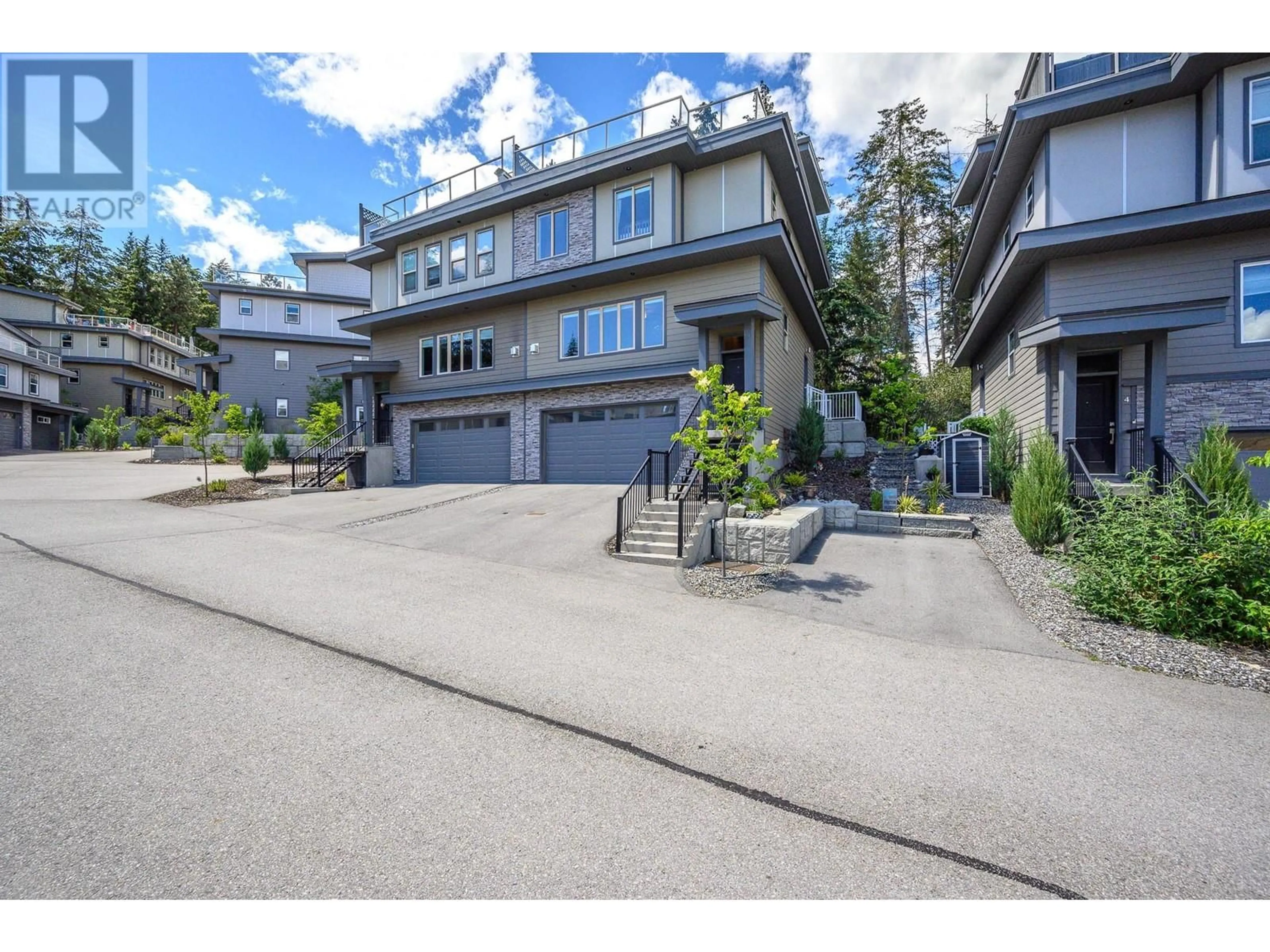 A pic from outside/outdoor area/front of a property/back of a property/a pic from drone, street for 7 - 2893 ROBINSON ROAD, Lake Country British Columbia V4V1H8