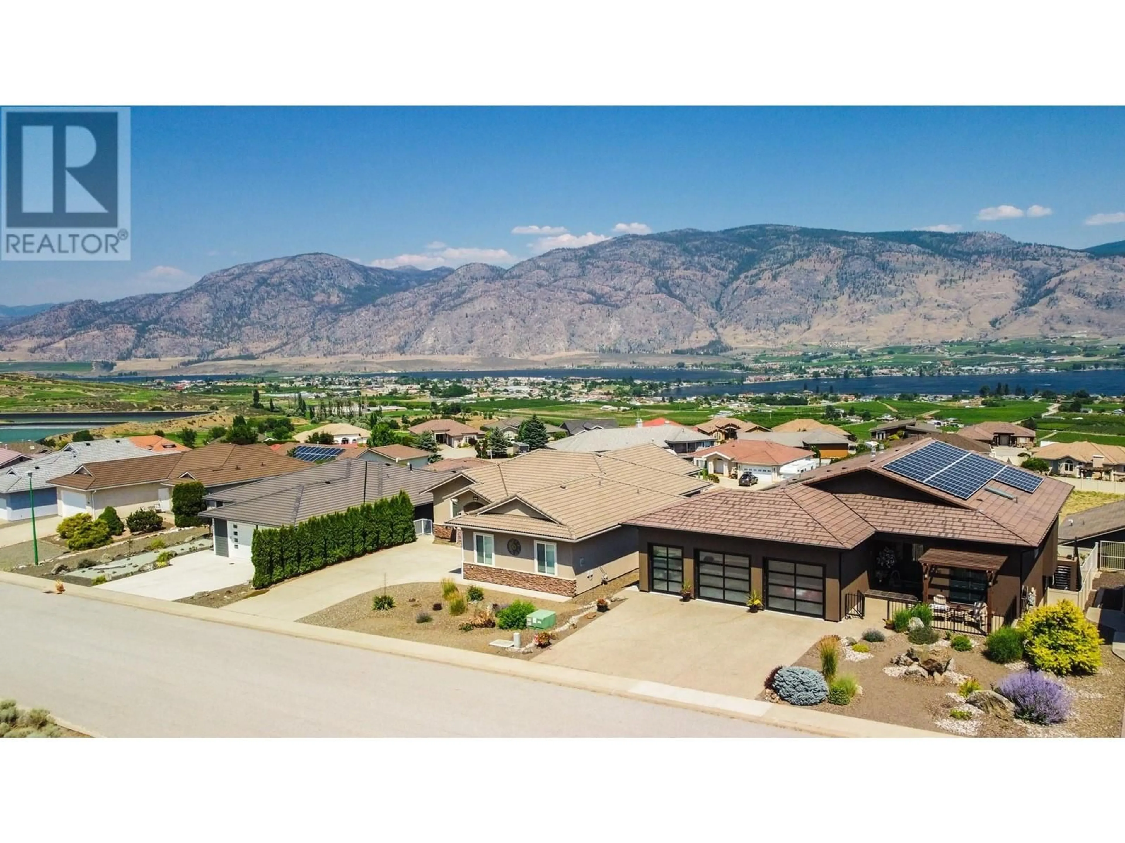 A pic from outside/outdoor area/front of a property/back of a property/a pic from drone, mountain view for 3631 SAWGRASS DRIVE, Osoyoos British Columbia V0H1V4