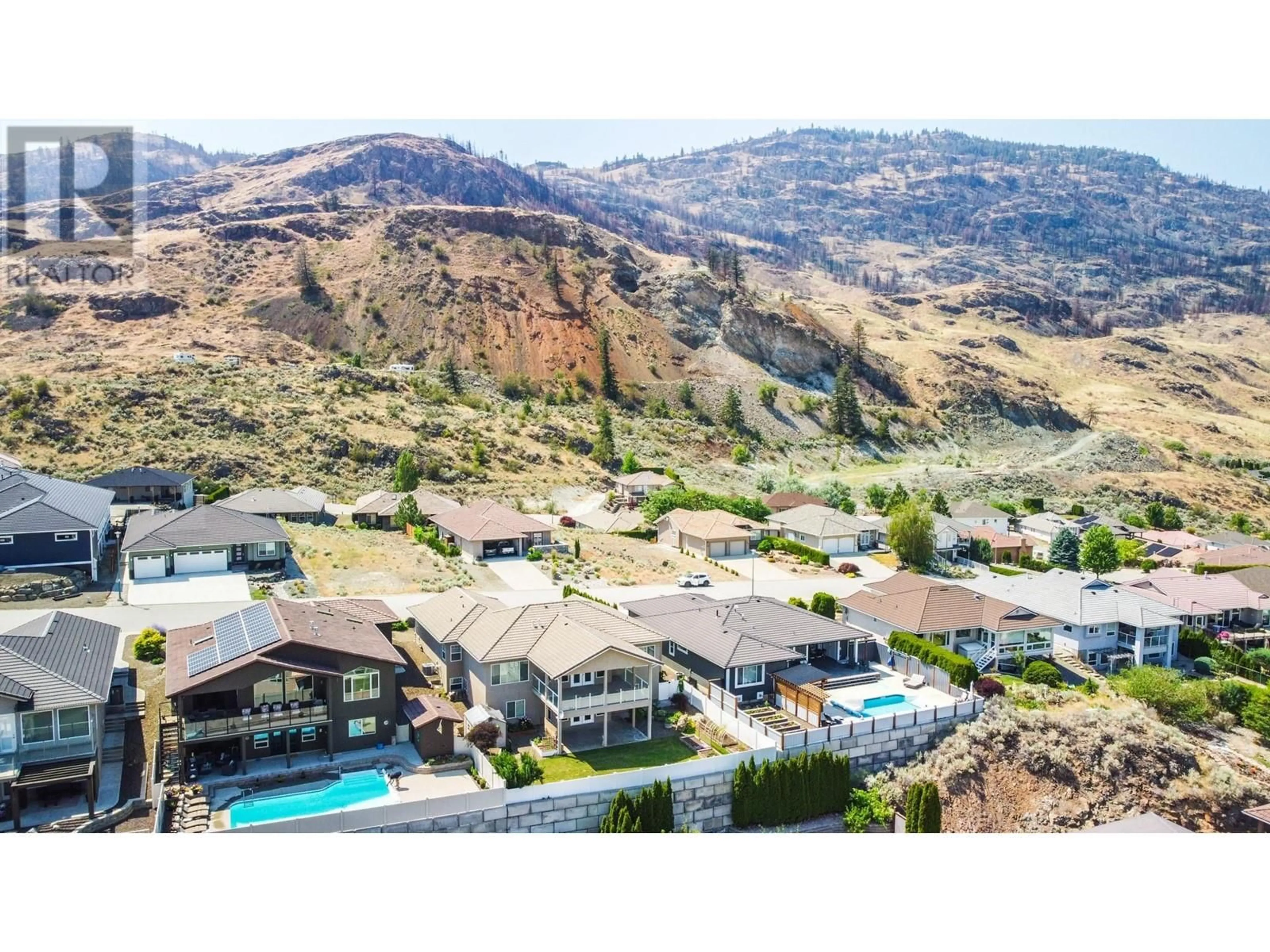 A pic from outside/outdoor area/front of a property/back of a property/a pic from drone, mountain view for 3631 SAWGRASS DRIVE, Osoyoos British Columbia V0H1V4