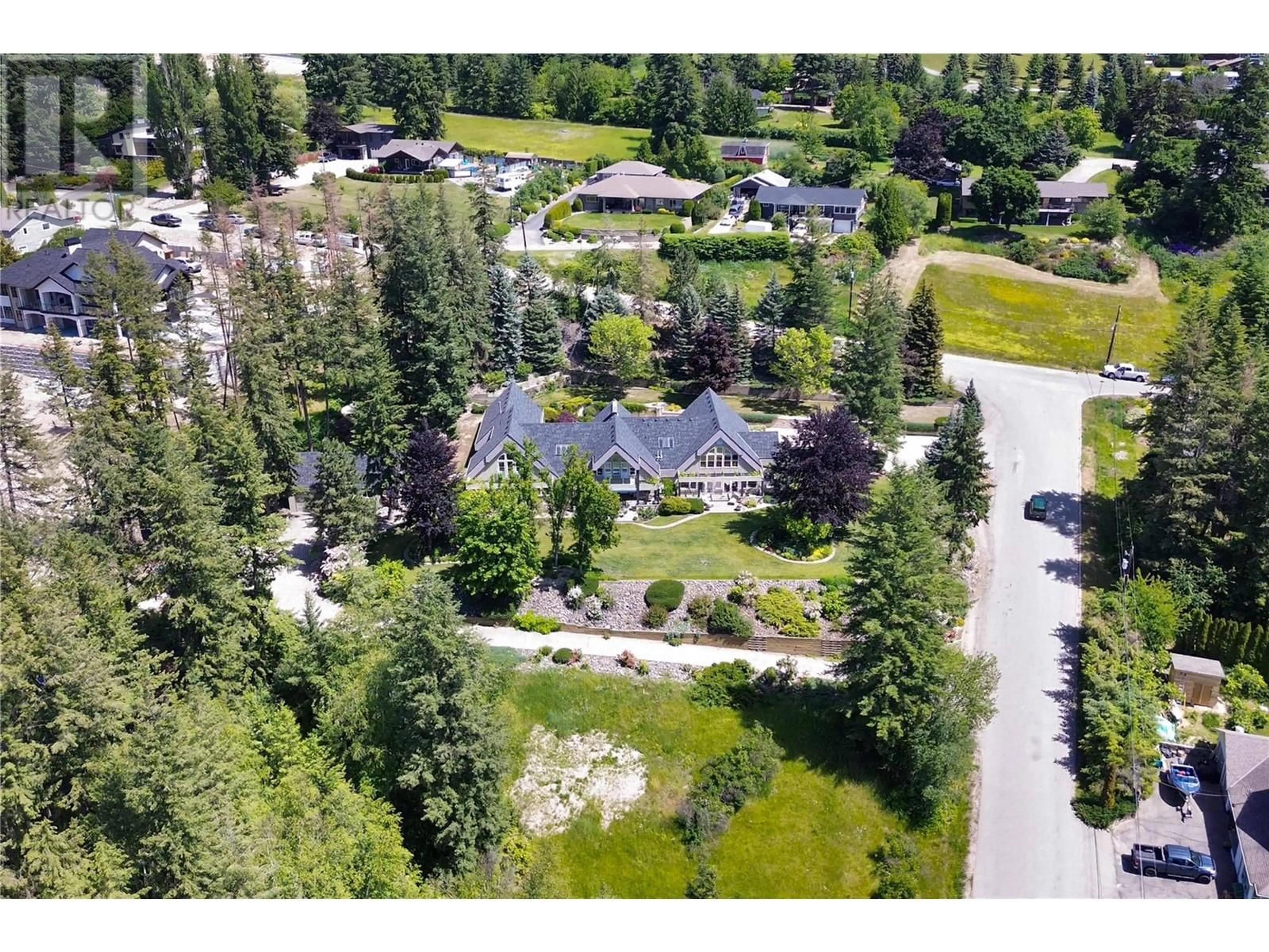 A pic from outside/outdoor area/front of a property/back of a property/a pic from drone, mountain view for 2391 26 Avenue NE, Salmon Arm British Columbia V1E2S6