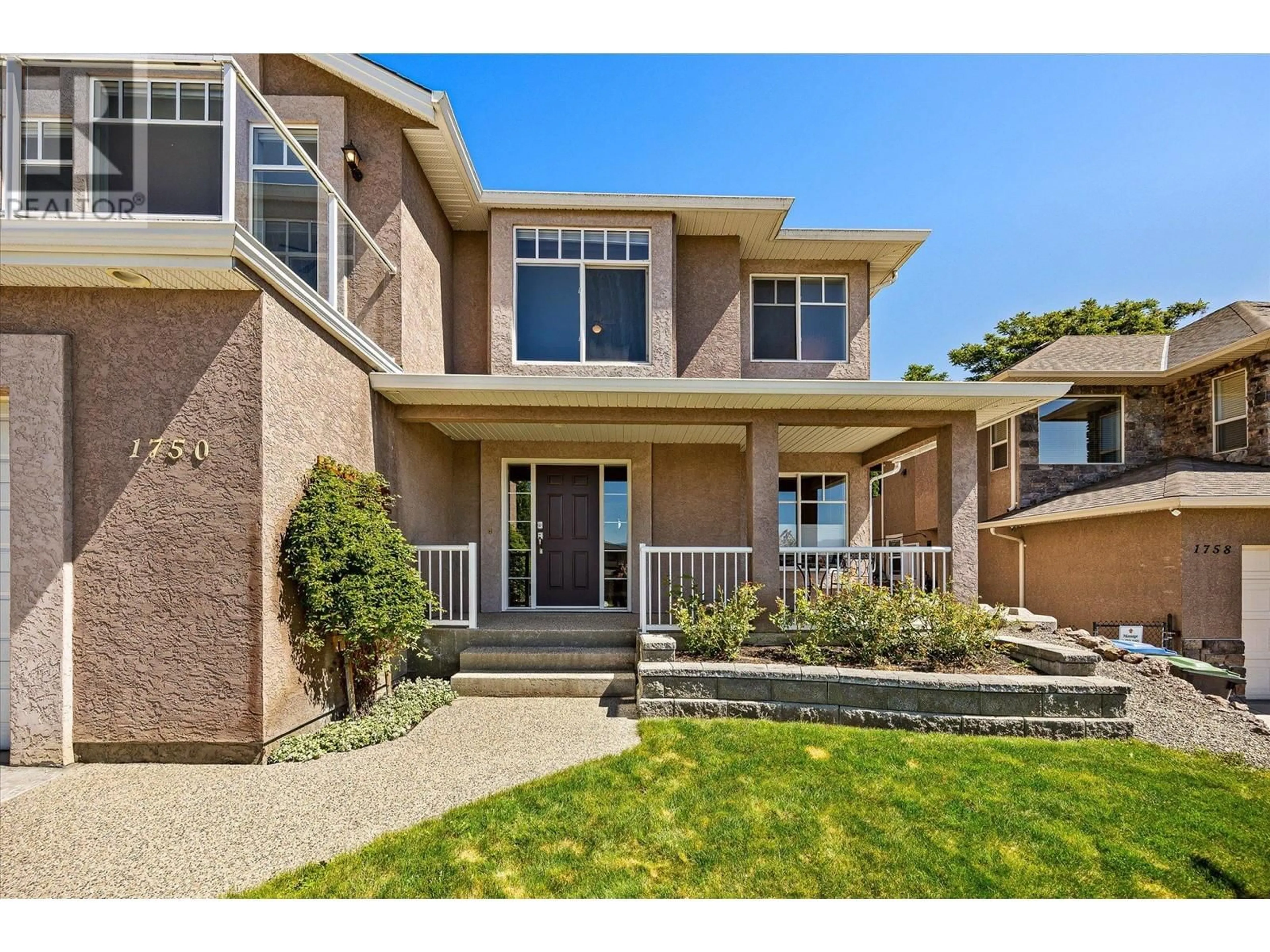 Home with brick exterior material, street for 1750 MARKHAM COURT, Kelowna British Columbia V1V2W1