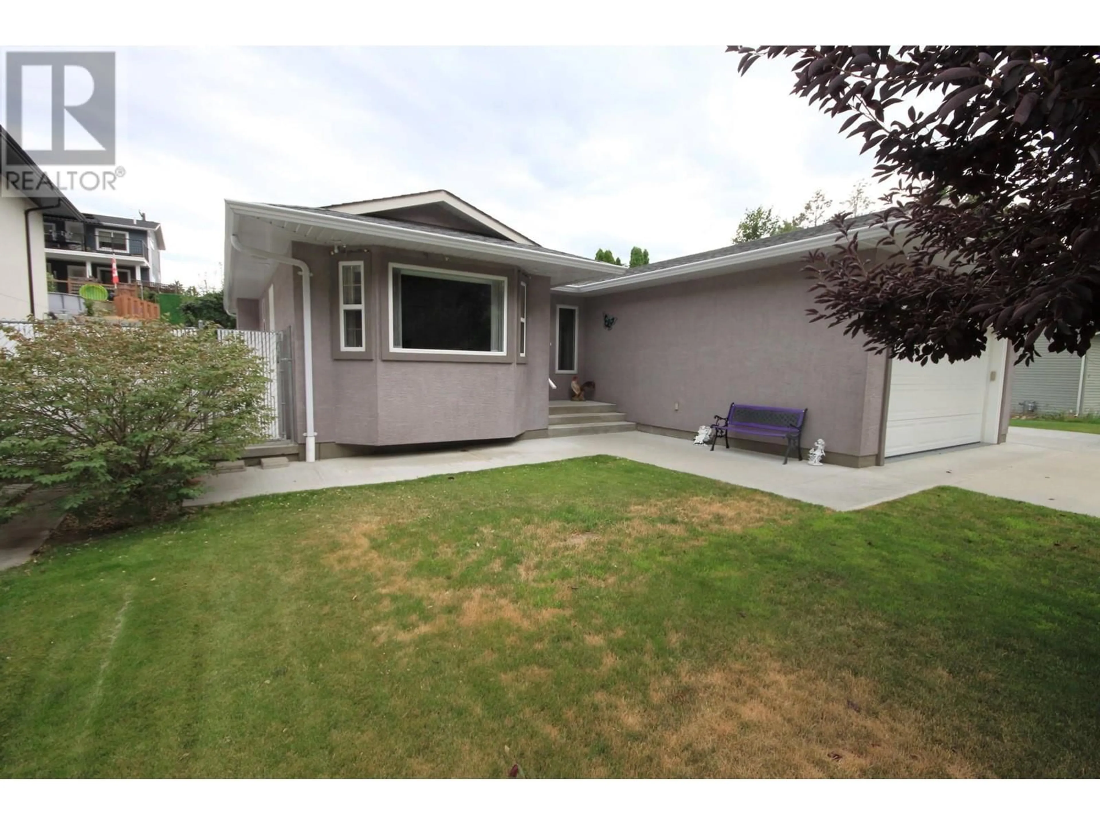 Home with vinyl exterior material, street for 957 MORNINGSTAR ROAD, Oliver British Columbia V0H1T6