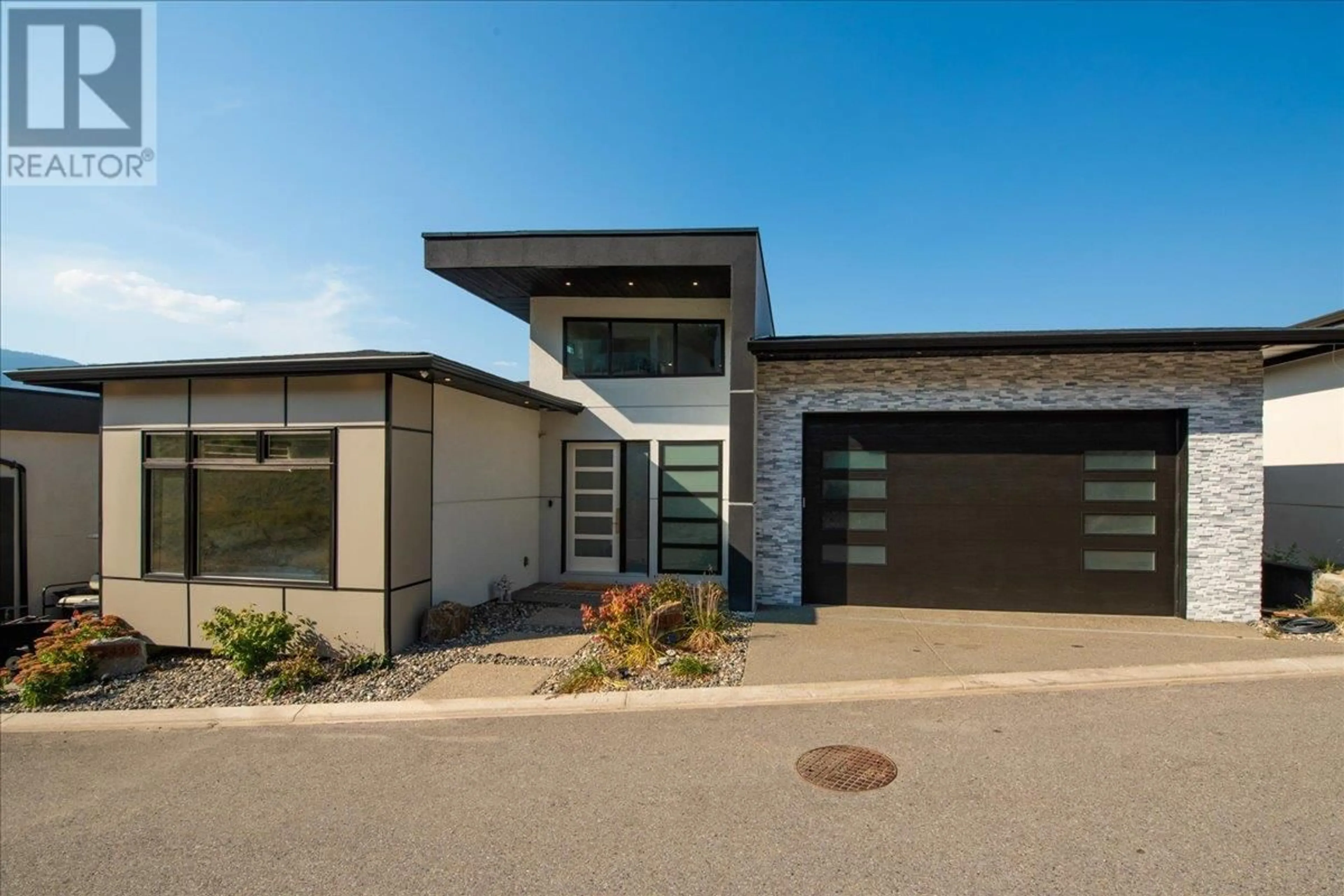 Home with brick exterior material, street for 3410 CHOCOLATE LILY LANE, Kelowna British Columbia V1V3G1