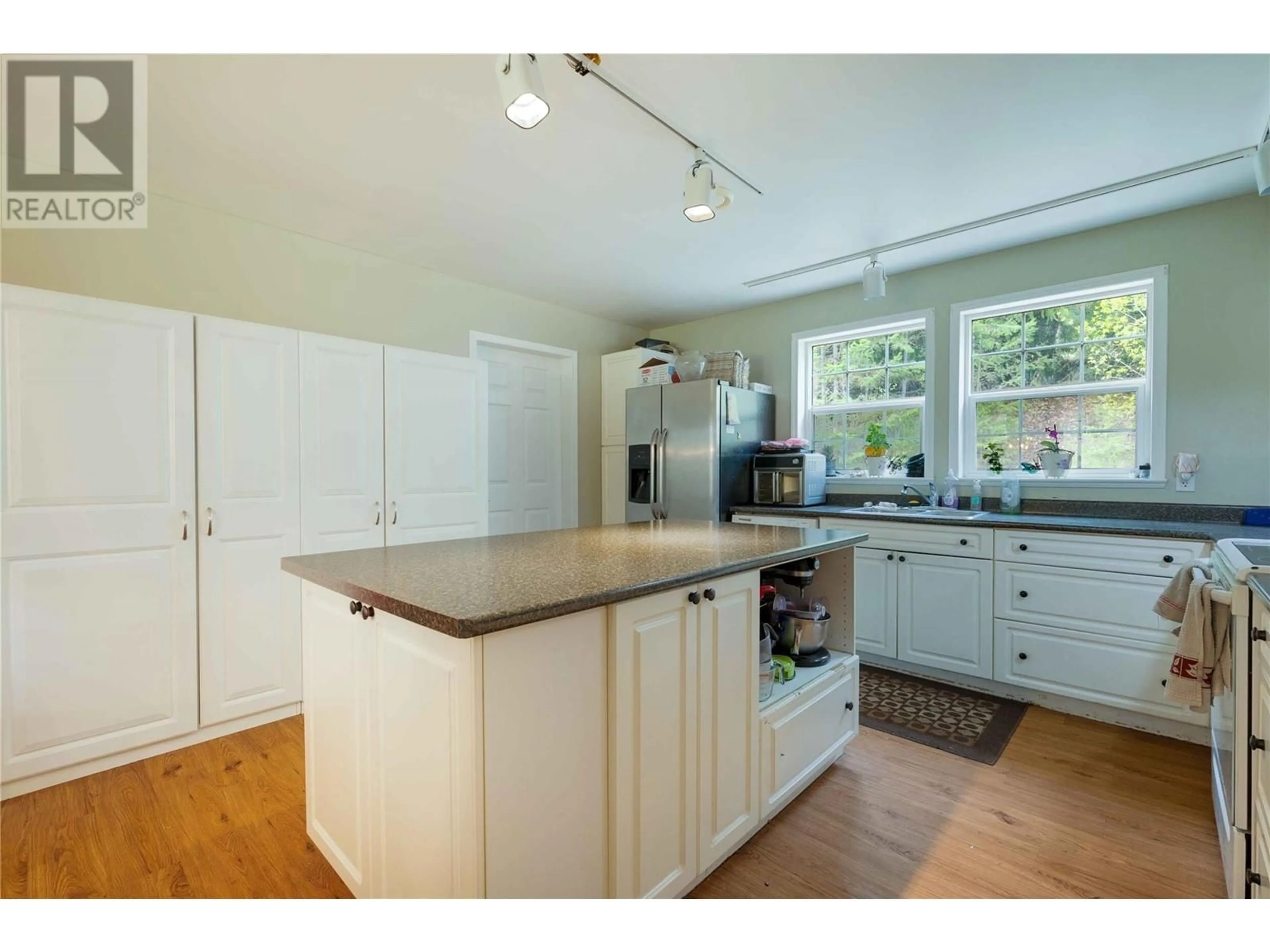 Open concept kitchen, wood/laminate floor for 1125 PTARMIGAN ROAD, Chase British Columbia V0E1M1
