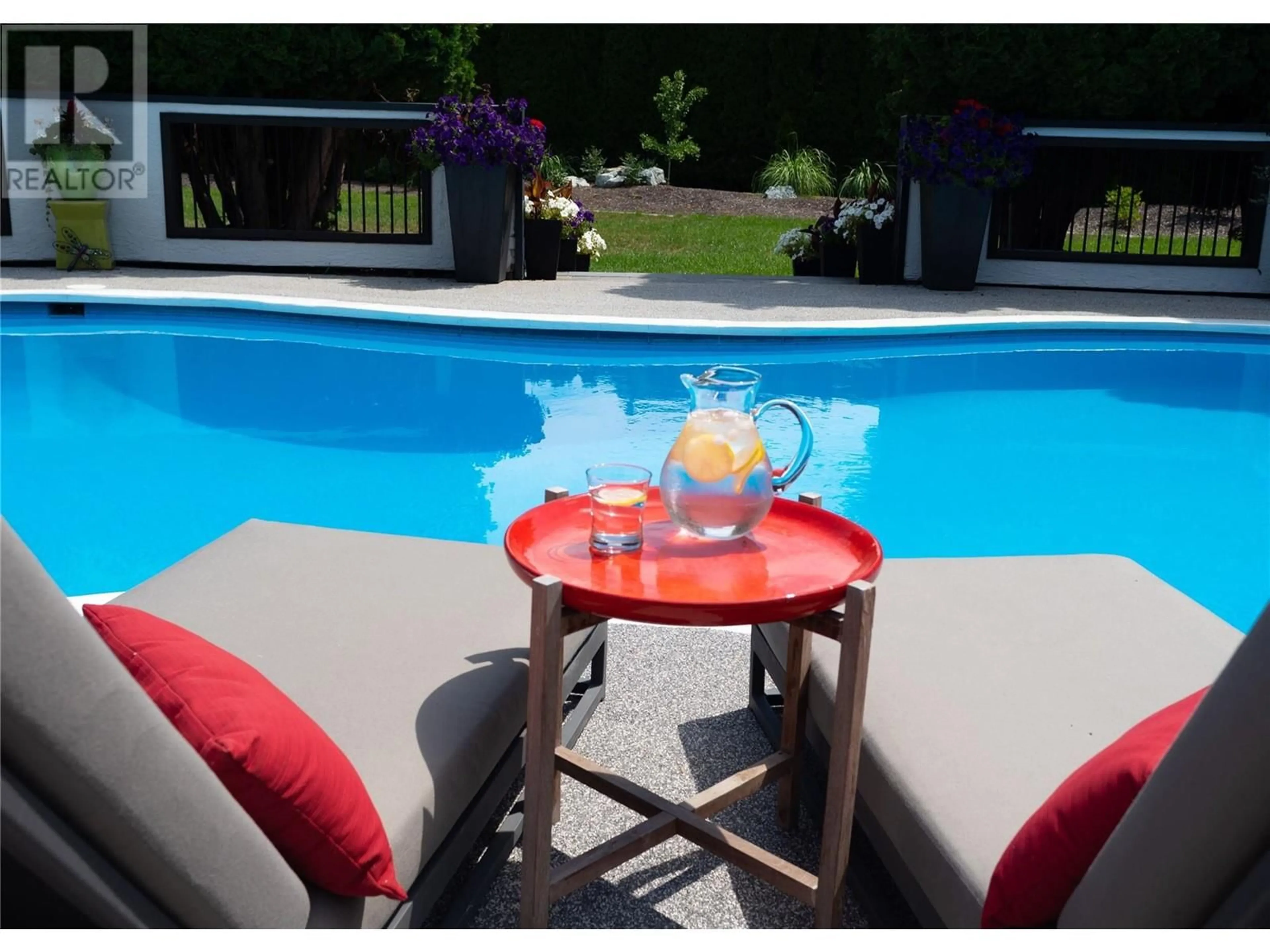 A pic from outside/outdoor area/front of a property/back of a property/a pic from drone, street for 771 TORRS ROAD, Kelowna British Columbia V1W1B4