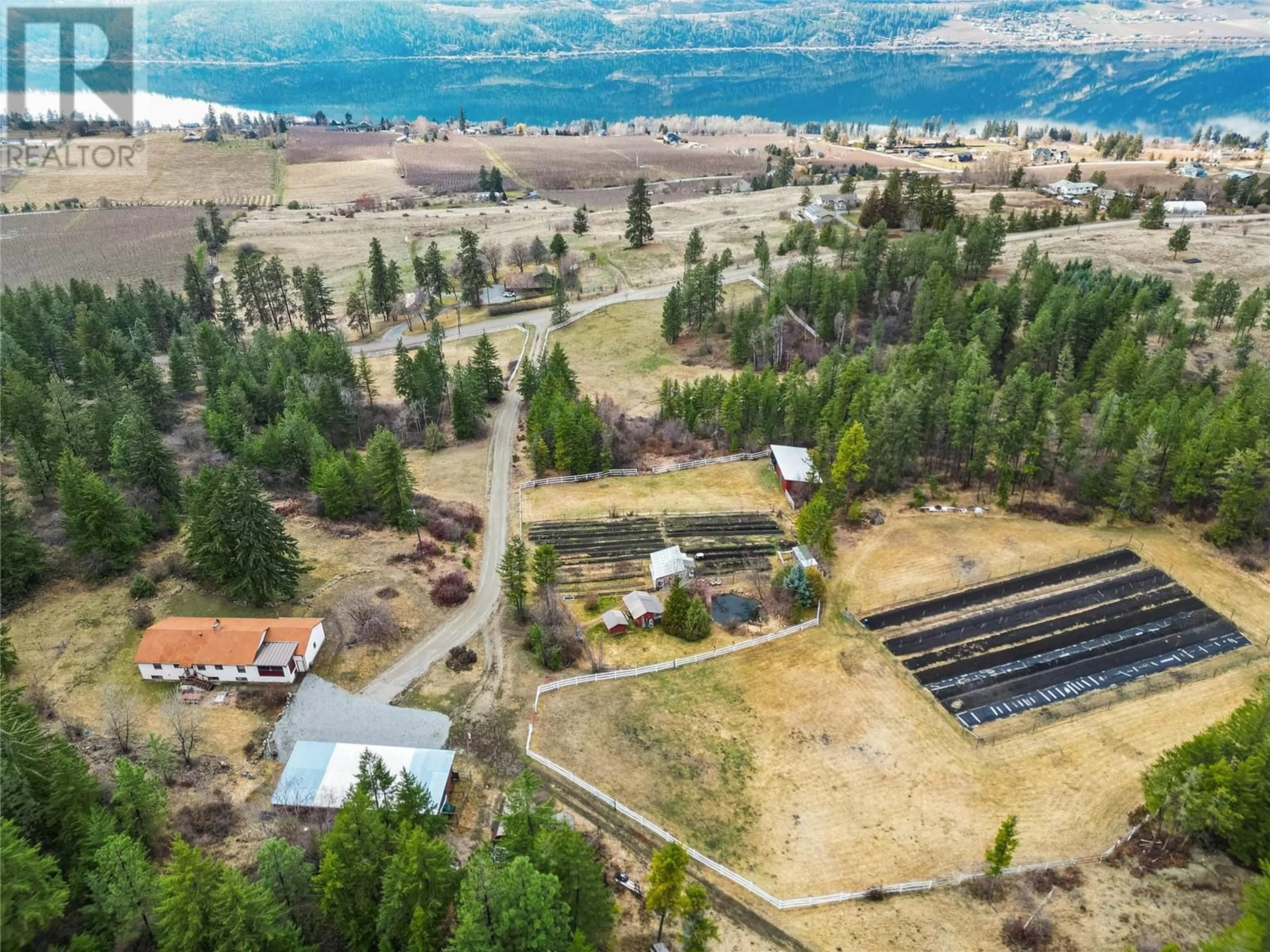 A pic from outside/outdoor area/front of a property/back of a property/a pic from drone, water/lake/river/ocean view for 13821 TALBOT ROAD, Lake Country British Columbia V4V2C2