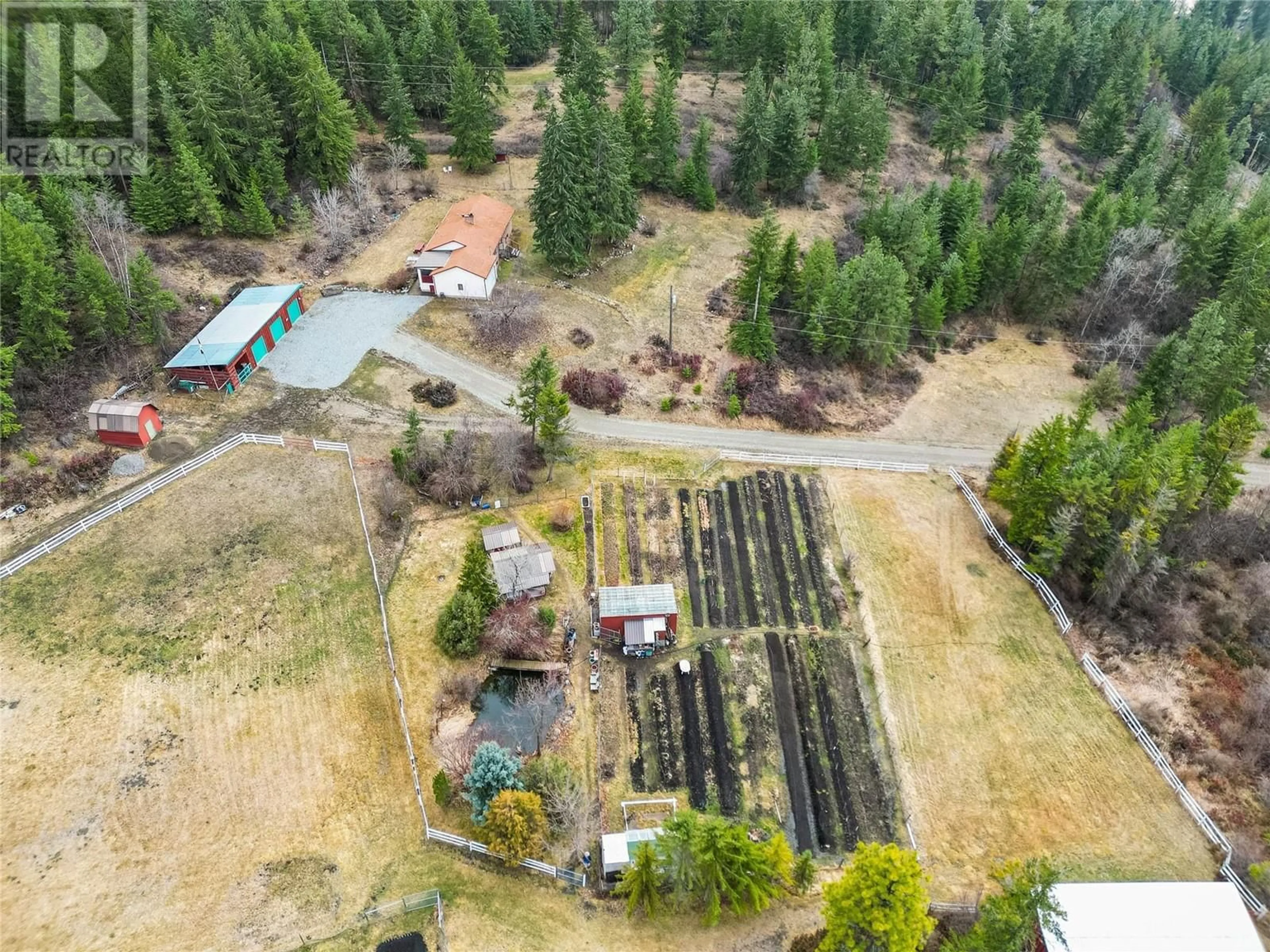 A pic from outside/outdoor area/front of a property/back of a property/a pic from drone, forest/trees view for 13821 TALBOT ROAD, Lake Country British Columbia V4V2C2