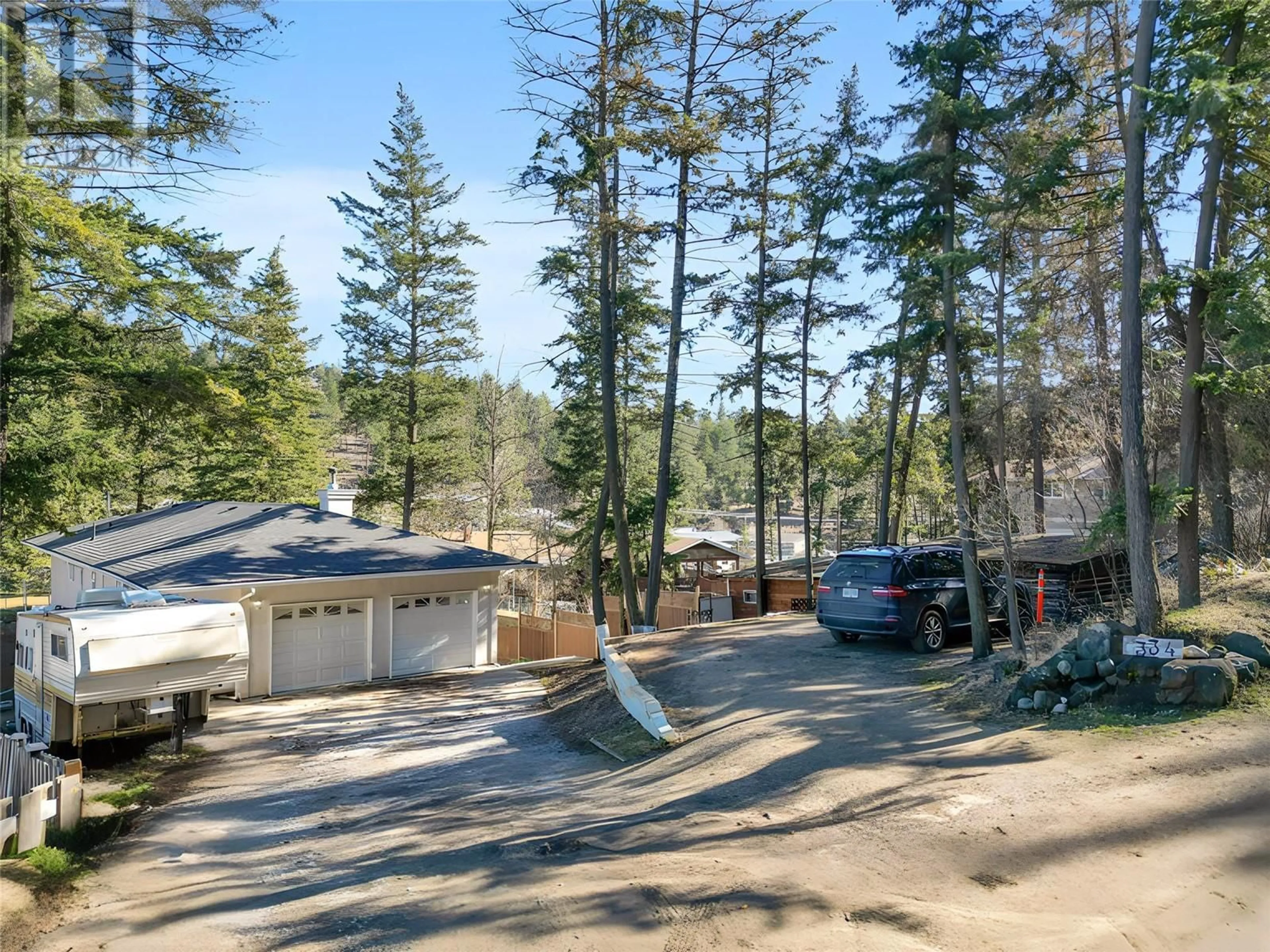 A pic from outside/outdoor area/front of a property/back of a property/a pic from drone, forest/trees view for 334 CLIFTON ROAD SOUTH, Kelowna British Columbia V1V1A5