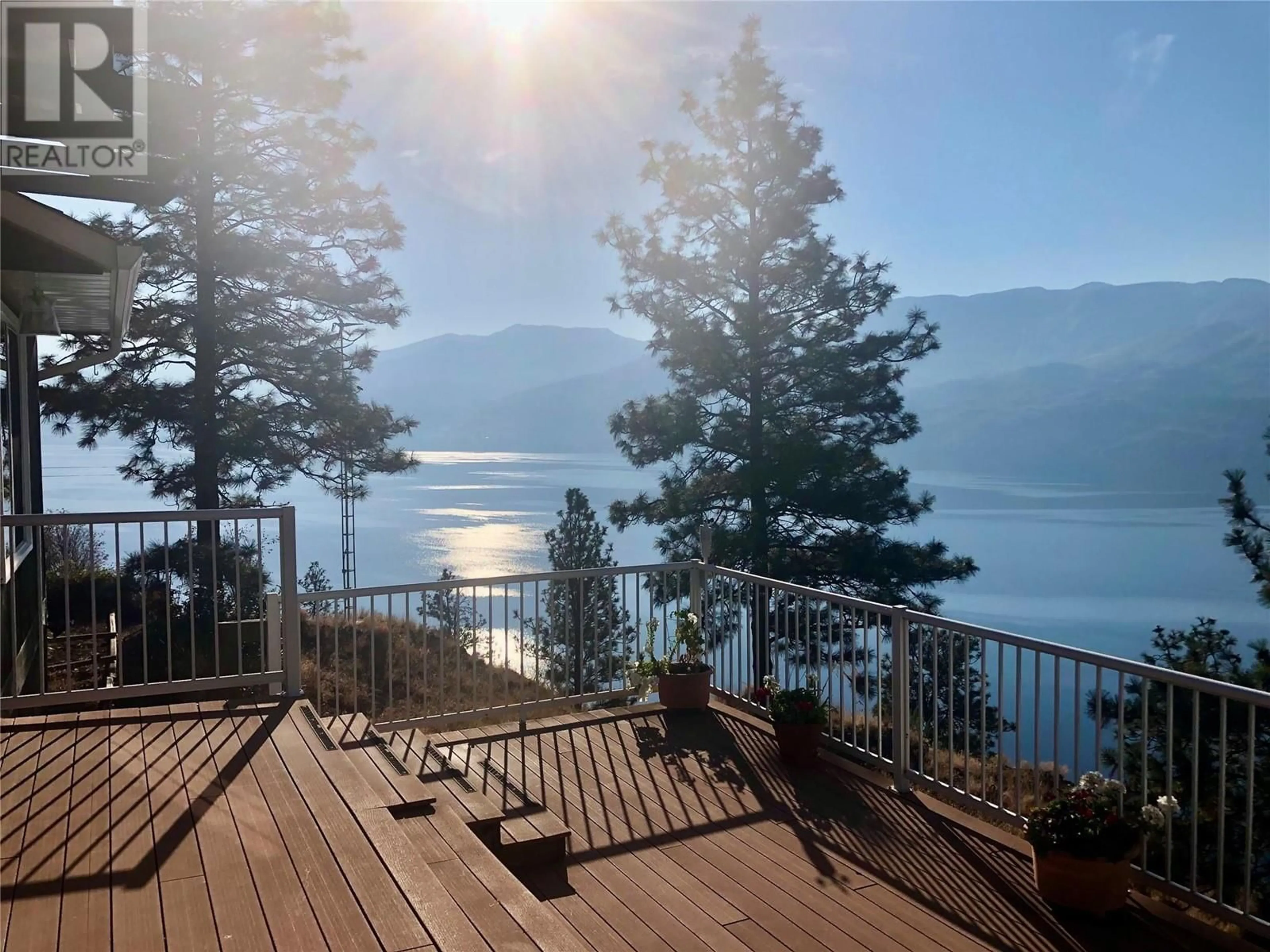 A pic from outside/outdoor area/front of a property/back of a property/a pic from drone, water/lake/river/ocean view for 3040 SECLUSION BAY ROAD, West Kelowna British Columbia V4T1W5