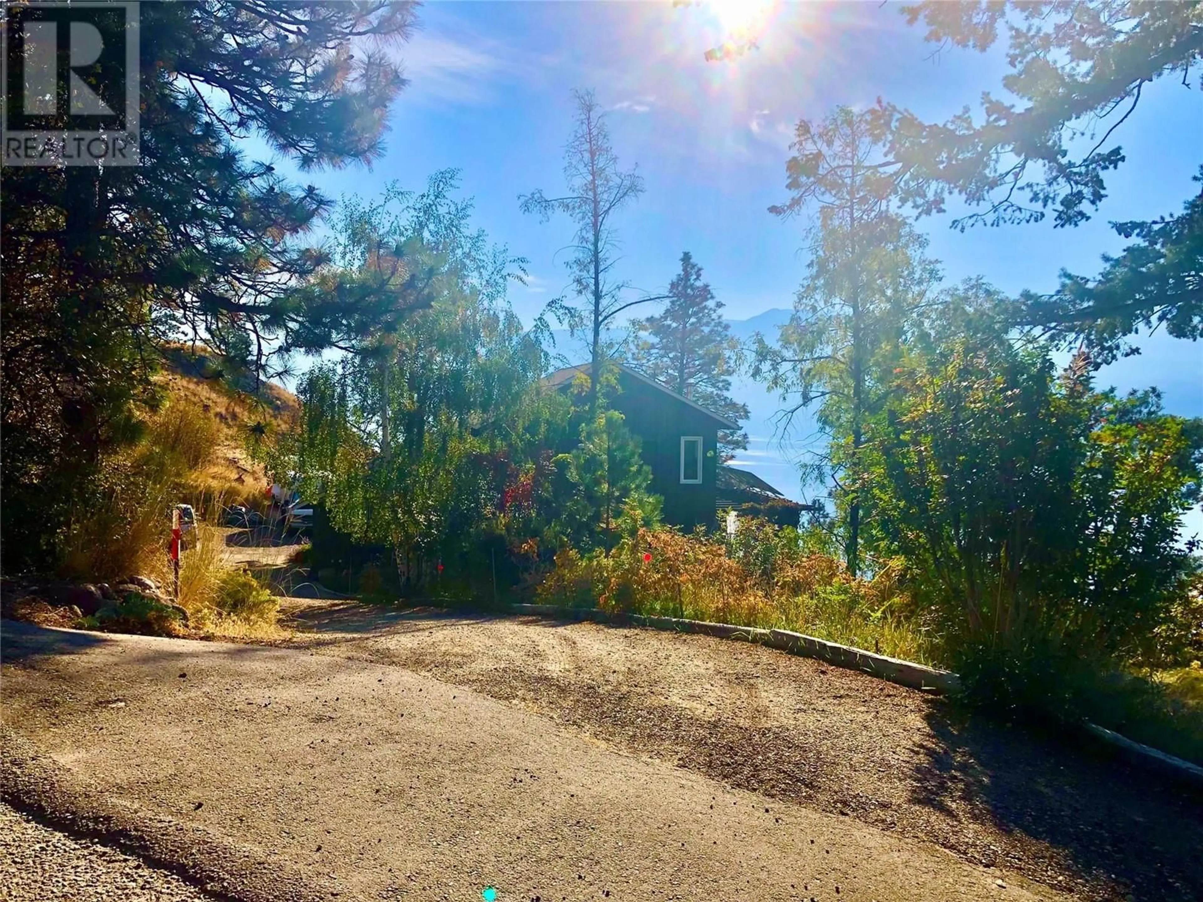 A pic from outside/outdoor area/front of a property/back of a property/a pic from drone, forest/trees view for 3040 SECLUSION BAY ROAD, West Kelowna British Columbia V4T1W5