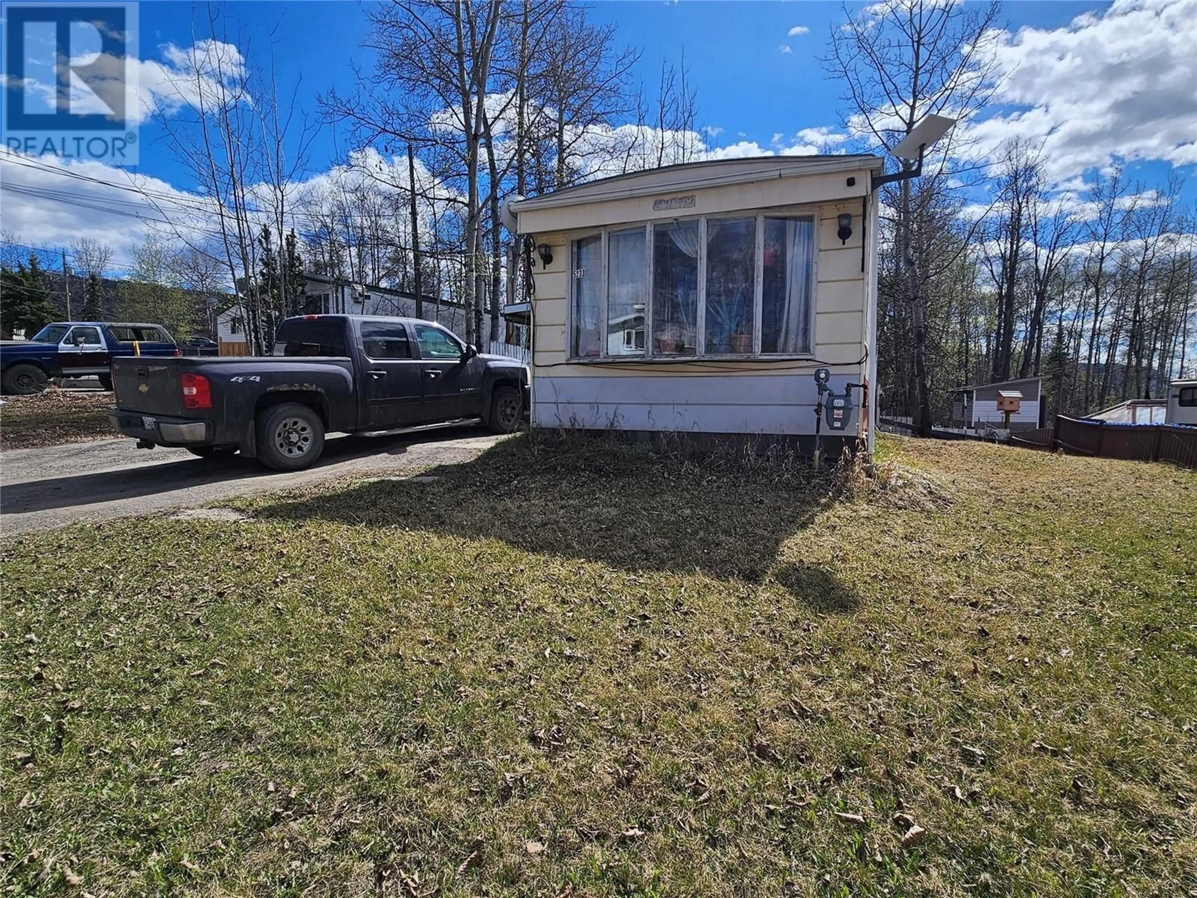 A pic from outside/outdoor area/front of a property/back of a property/a pic from drone, street for 5233 44 STREET SOUTHEAST, Chetwynd British Columbia V0C1J0