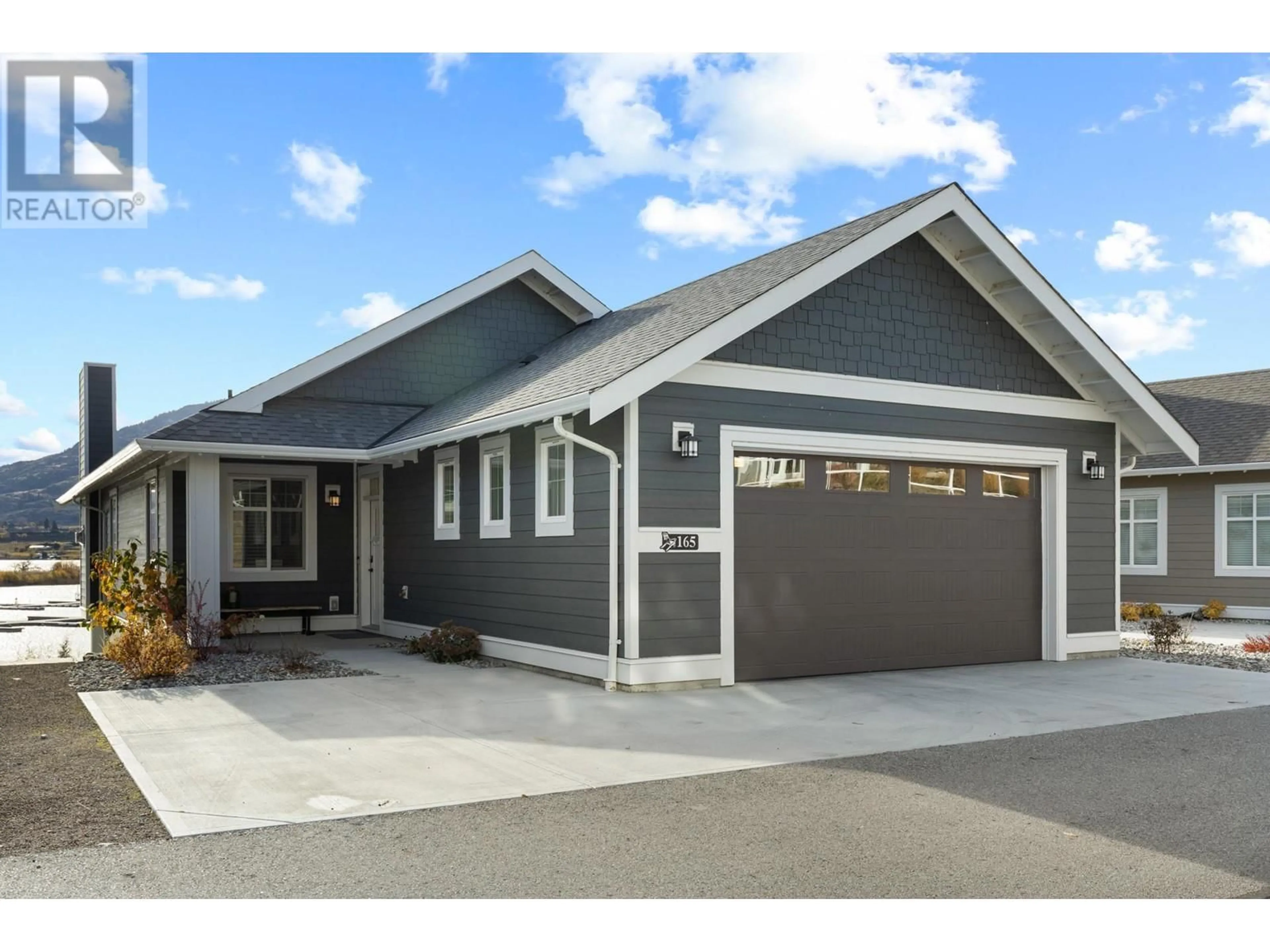 Home with vinyl exterior material, street for 165 - 2450 RADIO TOWER ROAD, Oliver British Columbia V0H1T1