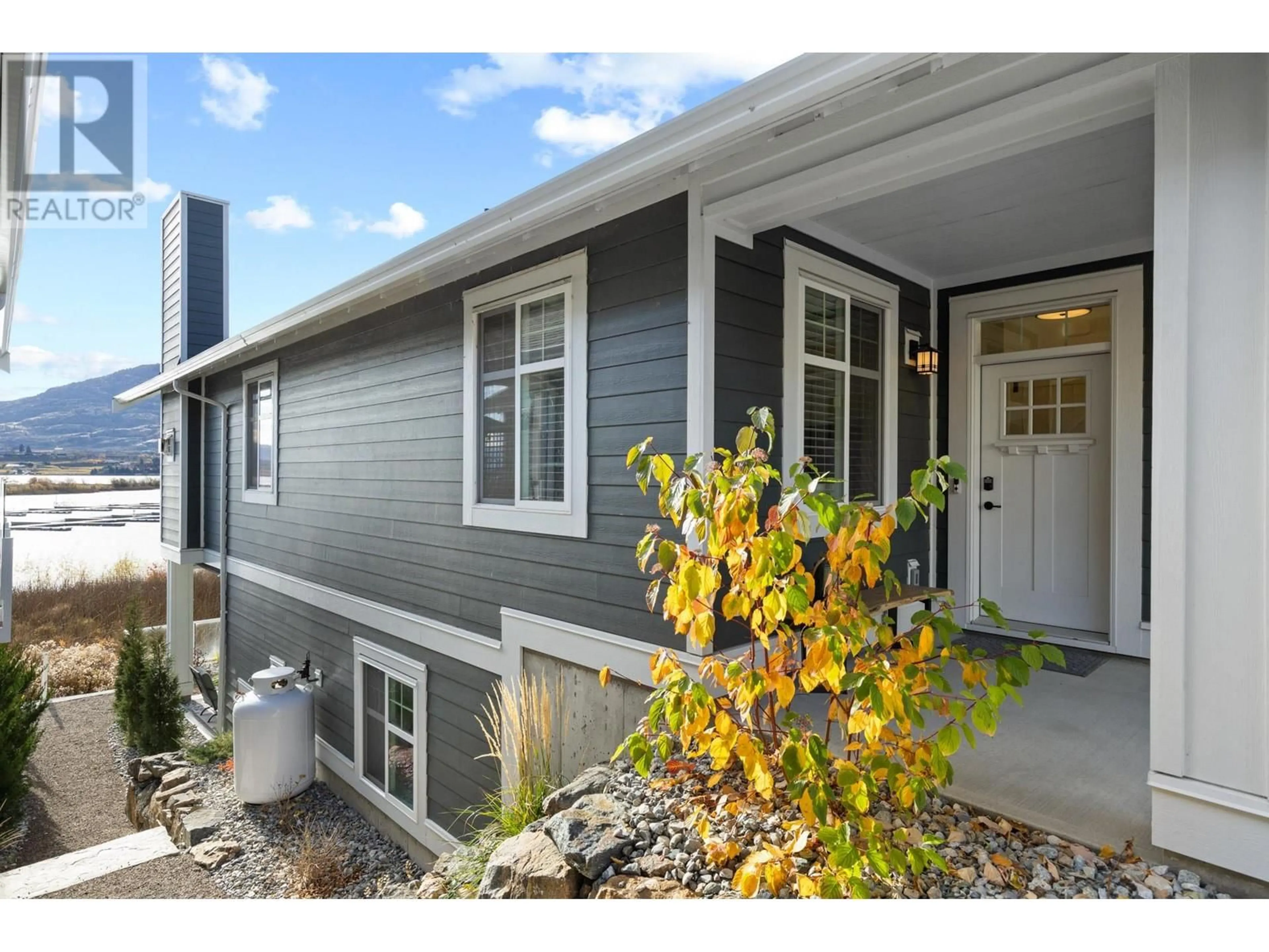 Home with vinyl exterior material, street for 165 - 2450 RADIO TOWER ROAD, Oliver British Columbia V0H1T1