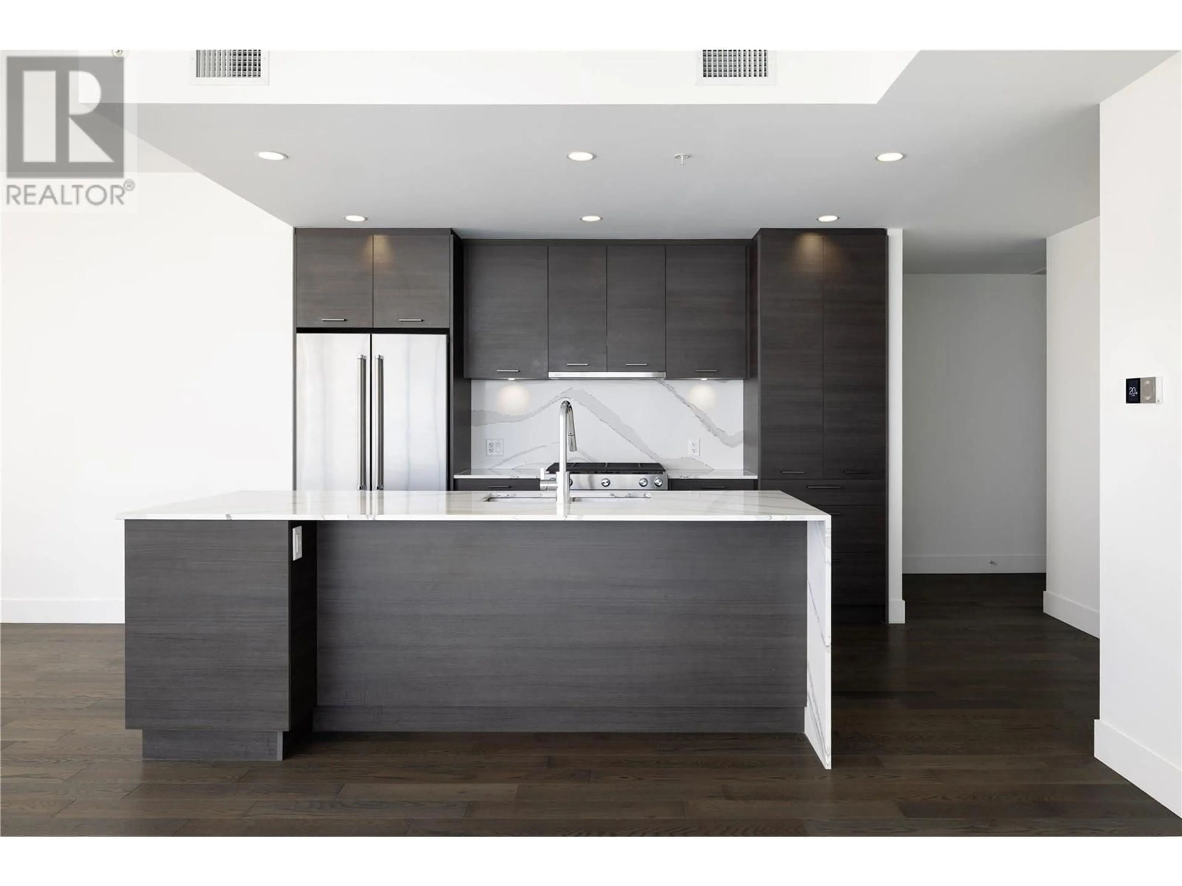 Open concept kitchen, wood/laminate floor for 1905 - 1181 SUNSET DRIVE, Kelowna British Columbia V1Y0J4