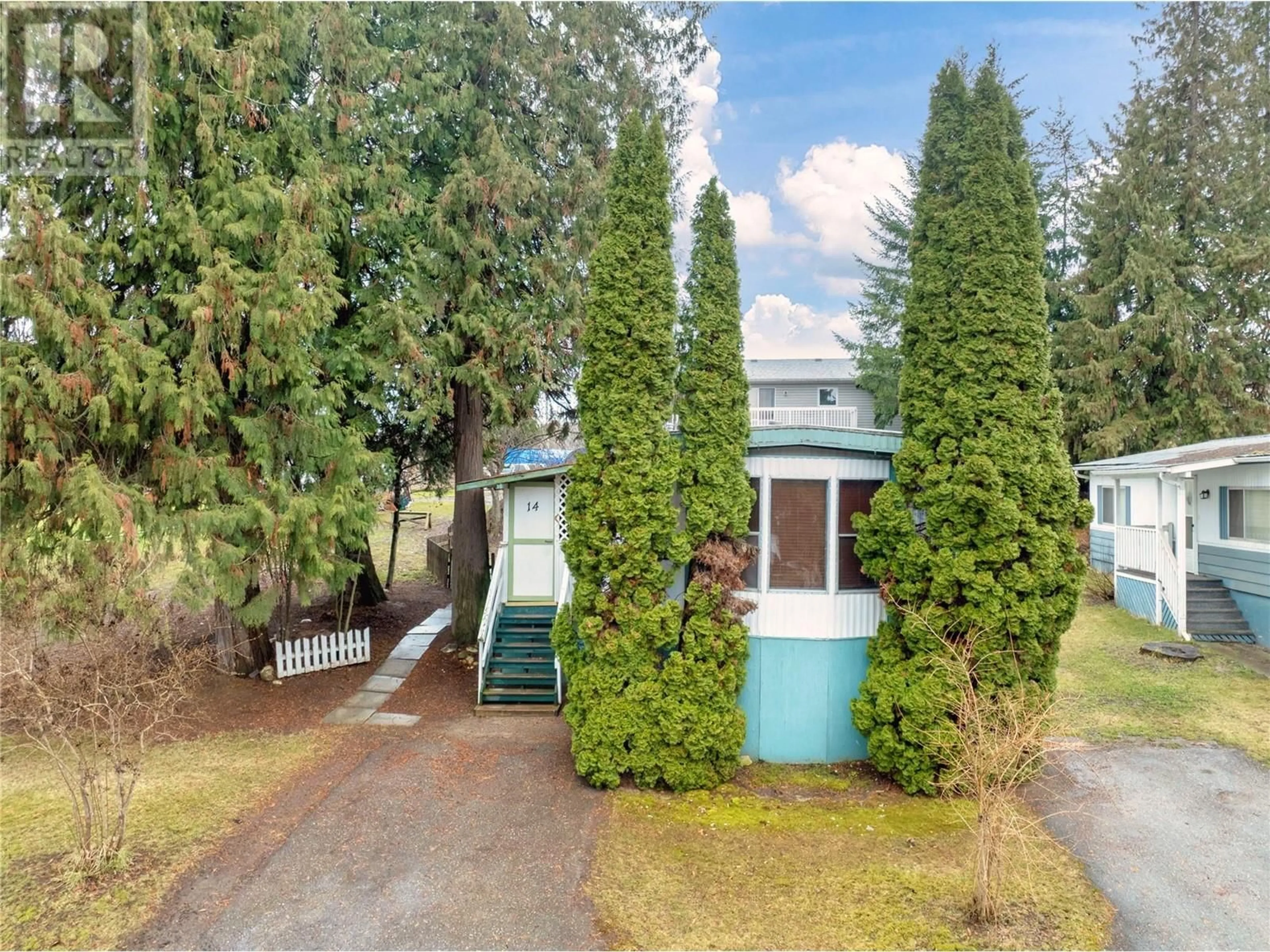 A pic from outside/outdoor area/front of a property/back of a property/a pic from drone, street for 14 - 4061 11 AVENUE NORTHEAST, Salmon Arm British Columbia V1E1C7