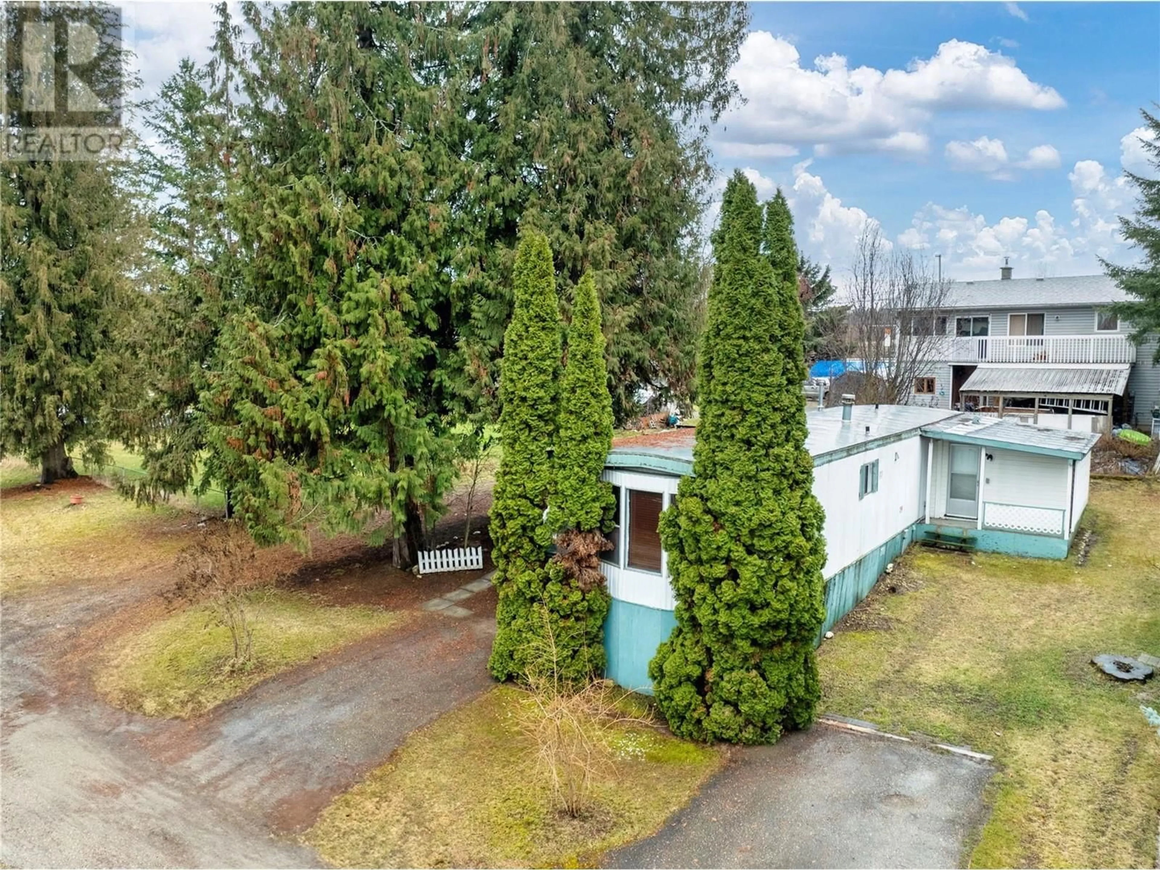 A pic from outside/outdoor area/front of a property/back of a property/a pic from drone, street for 14 - 4061 11 AVENUE NORTHEAST, Salmon Arm British Columbia V1E1C7