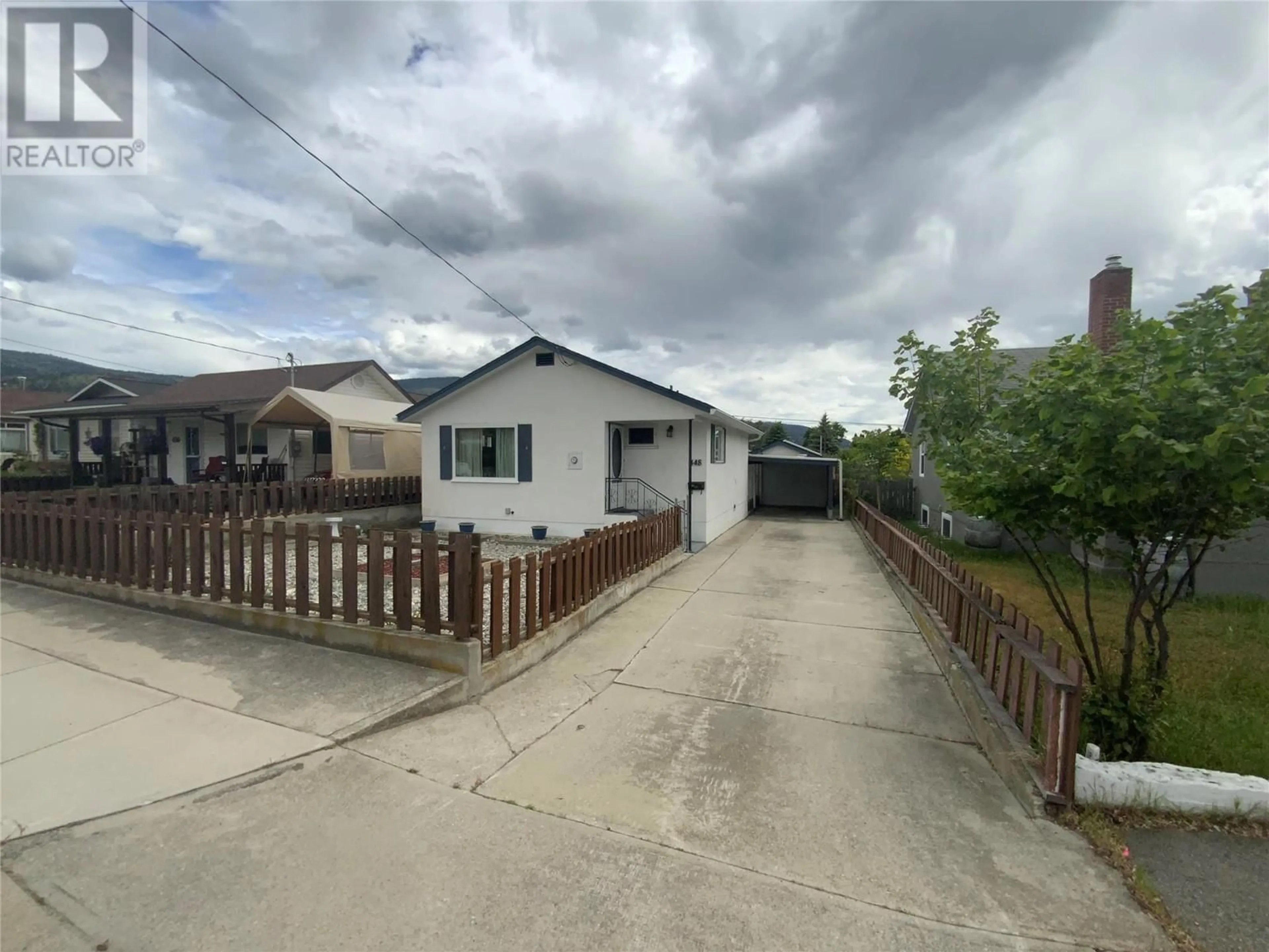 A pic from outside/outdoor area/front of a property/back of a property/a pic from drone, street for 448 BENNETT AVENUE, Penticton British Columbia V2A2P6