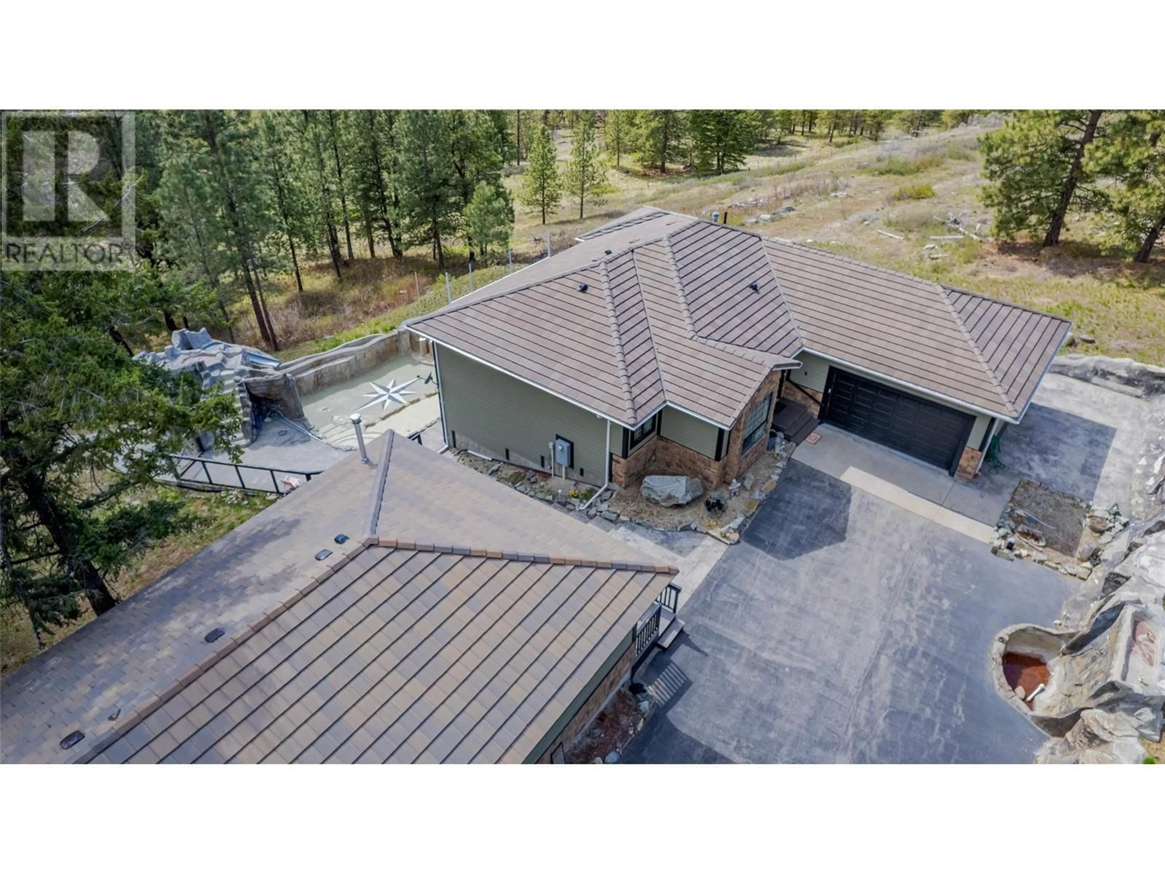 A pic from outside/outdoor area/front of a property/back of a property/a pic from drone, unknown for 1370 BULLMOOSE WAY, Osoyoos British Columbia V0H1V6